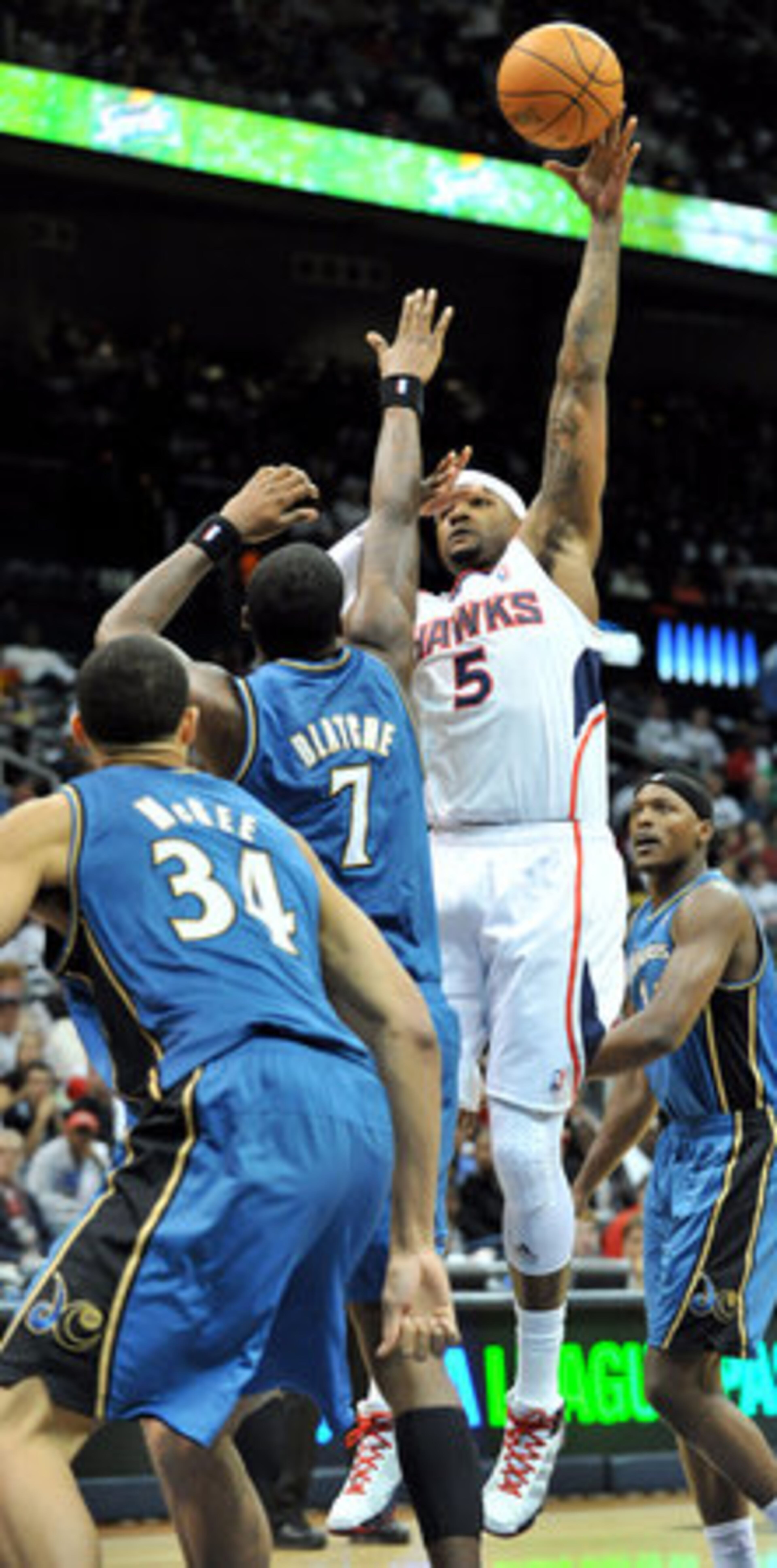 Atlanta Hawks Josh Smith shoots (5) over Washington Wizards Andray Blatche (7) in the first half of the first home game at Philips Arena in Atlanta on Saturday, Oct. 30, 2010.