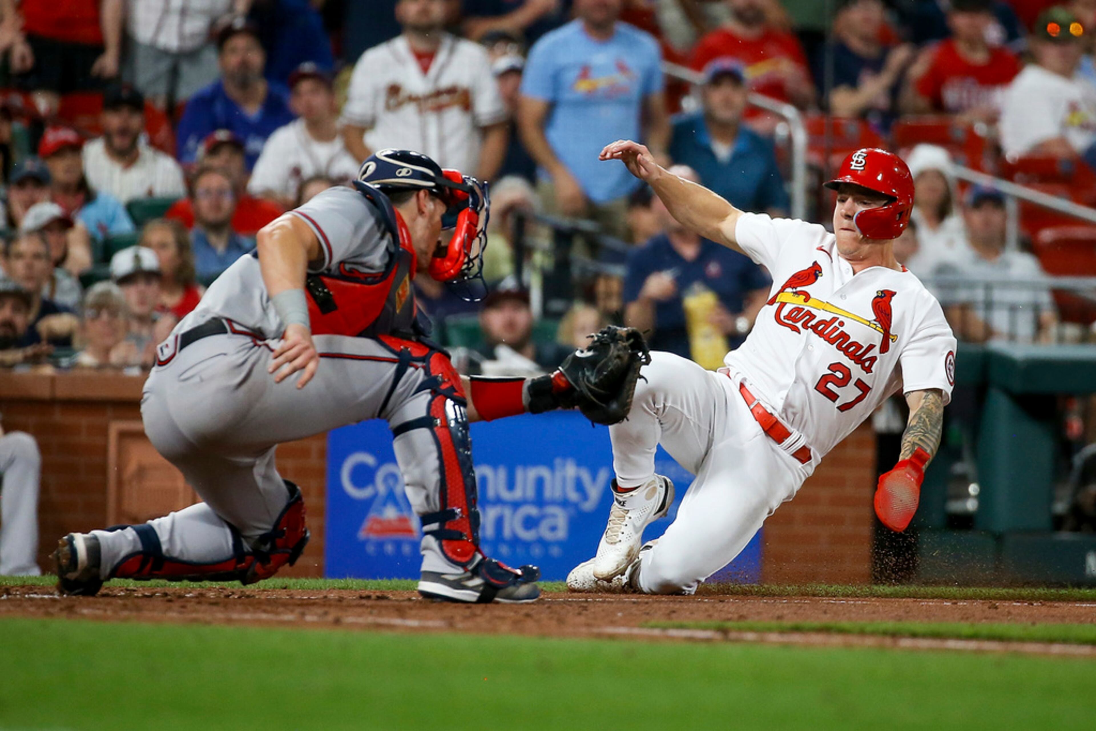 St. Louis Cardinals' Tyler O'Neill is tagged out at home by Atlanta Braves catcher Sean Murphy during the seventh inning of a baseball game Tuesday, April 4, 2023, in St. Louis. (AP Photo/Scott Kane)
