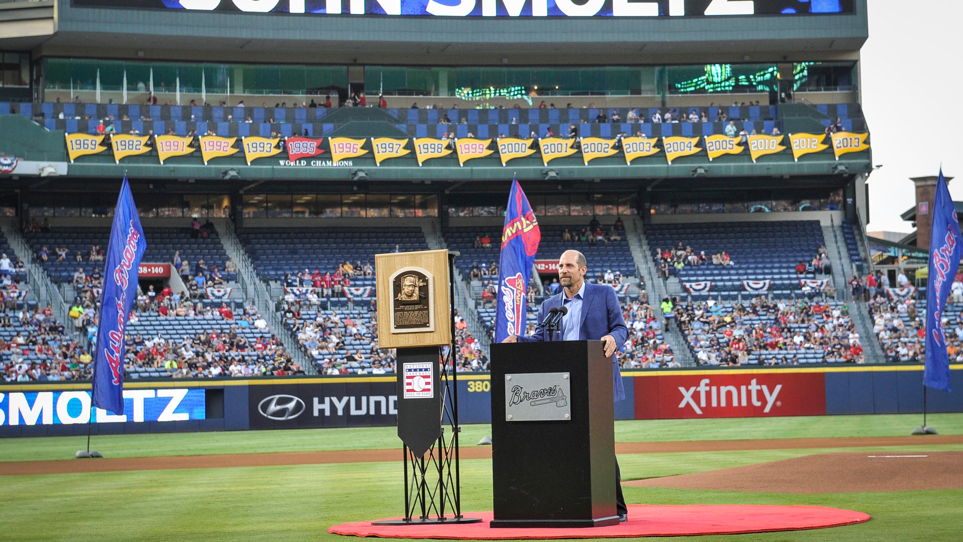 Former Atlanta Braves pitcher John Smoltz is honored for his induction into the Baseball Hall of Fame before the start of a baseball game against the Arizona Diamondbacks, Friday, Aug. 14, 2015, in Atlanta. (AP Photo/John Amis)