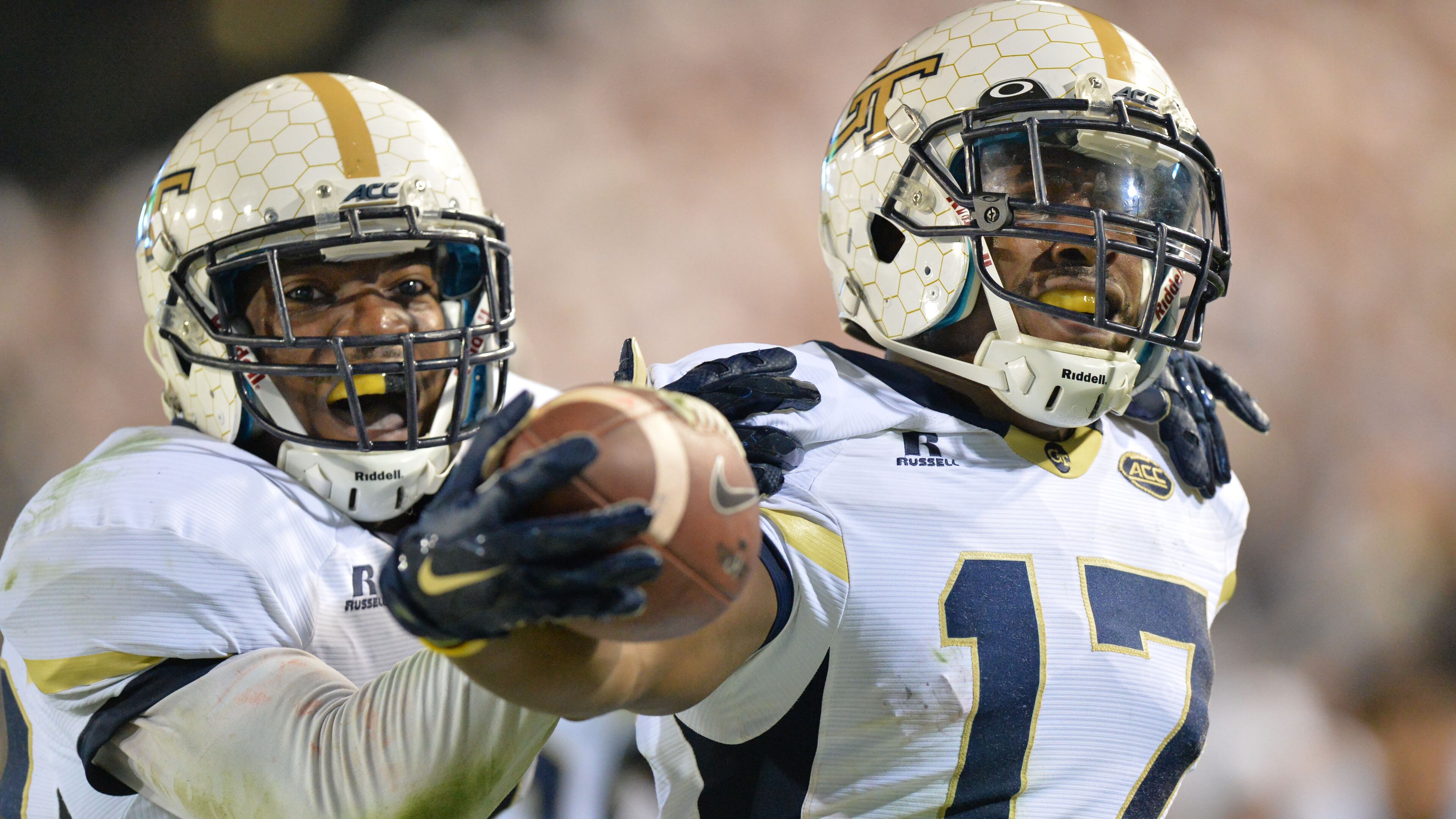Georgia Tech defensive back Lance Austin (17) is celebrated by twin brother and defensive back Lawrence Austin after he scored a touchdown at the end of the fourth quarter at Bobby Dodd Stadium on Saturday, October 24, 2015. Georgia Tech won 22 - 16 over Florida State. HYOSUB SHIN / HSHIN@AJC.COM