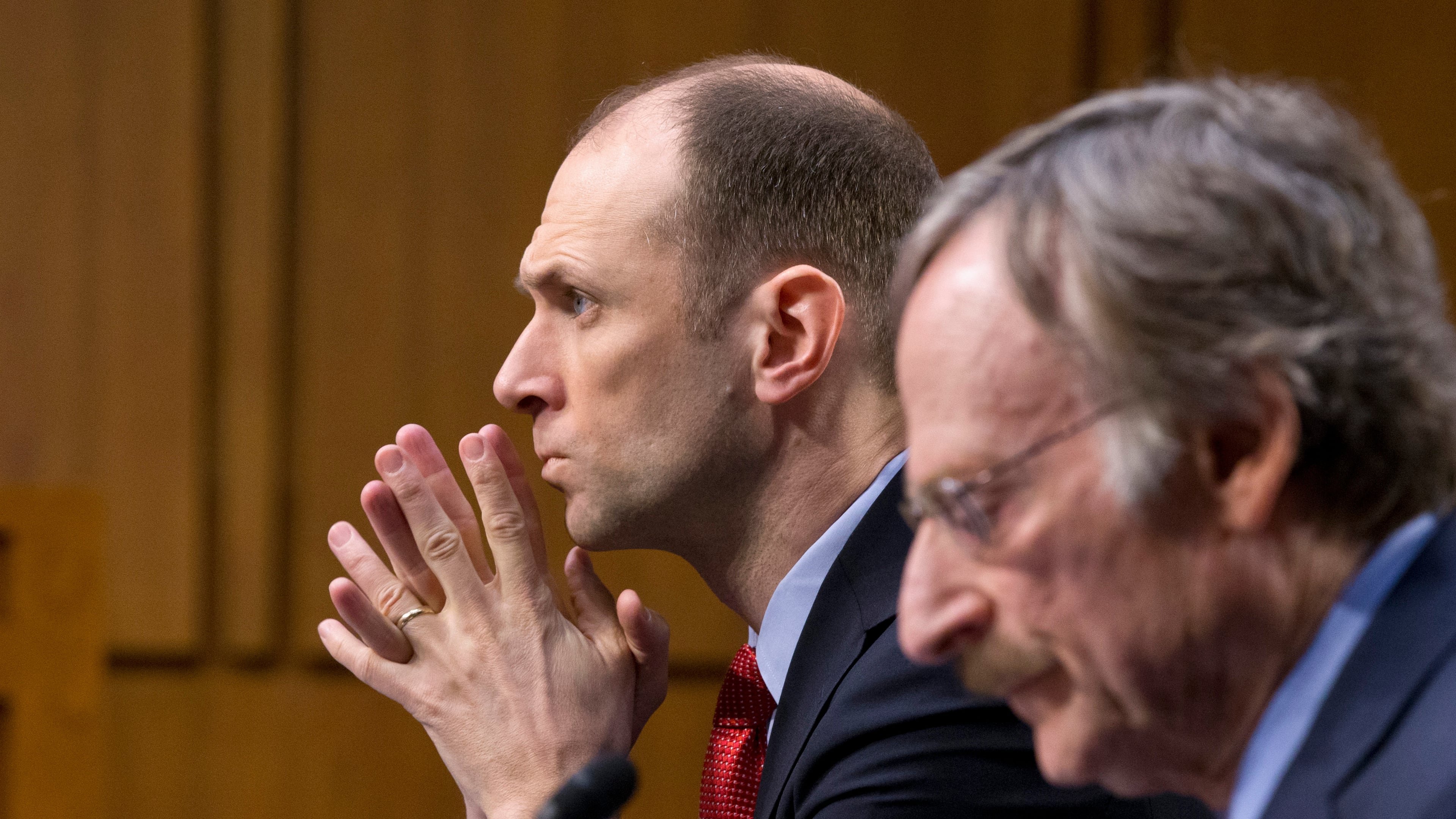 FILE - Austan Goolsbee, left, then-Council of Economic Advisers Chairman under President Barack Obama, testifies on Capitol Hill in Washingto, Feb. 28, 2013. (AP Photo/J. Scott Applewhite, File)