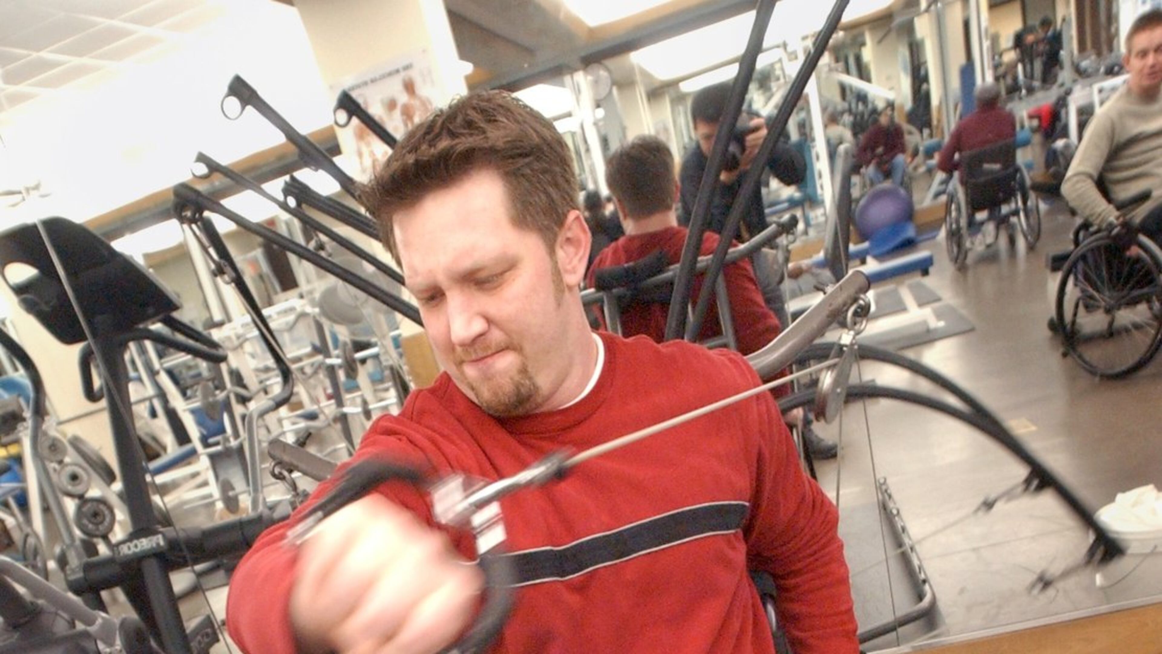 Terry Kirby works out at Shepherd Spinal Center in 2004. He was paralyzed when he was shot during a robbery at Sidelines Sports Grille about two years earlier. (SUNNY SUNG/AJC staff)