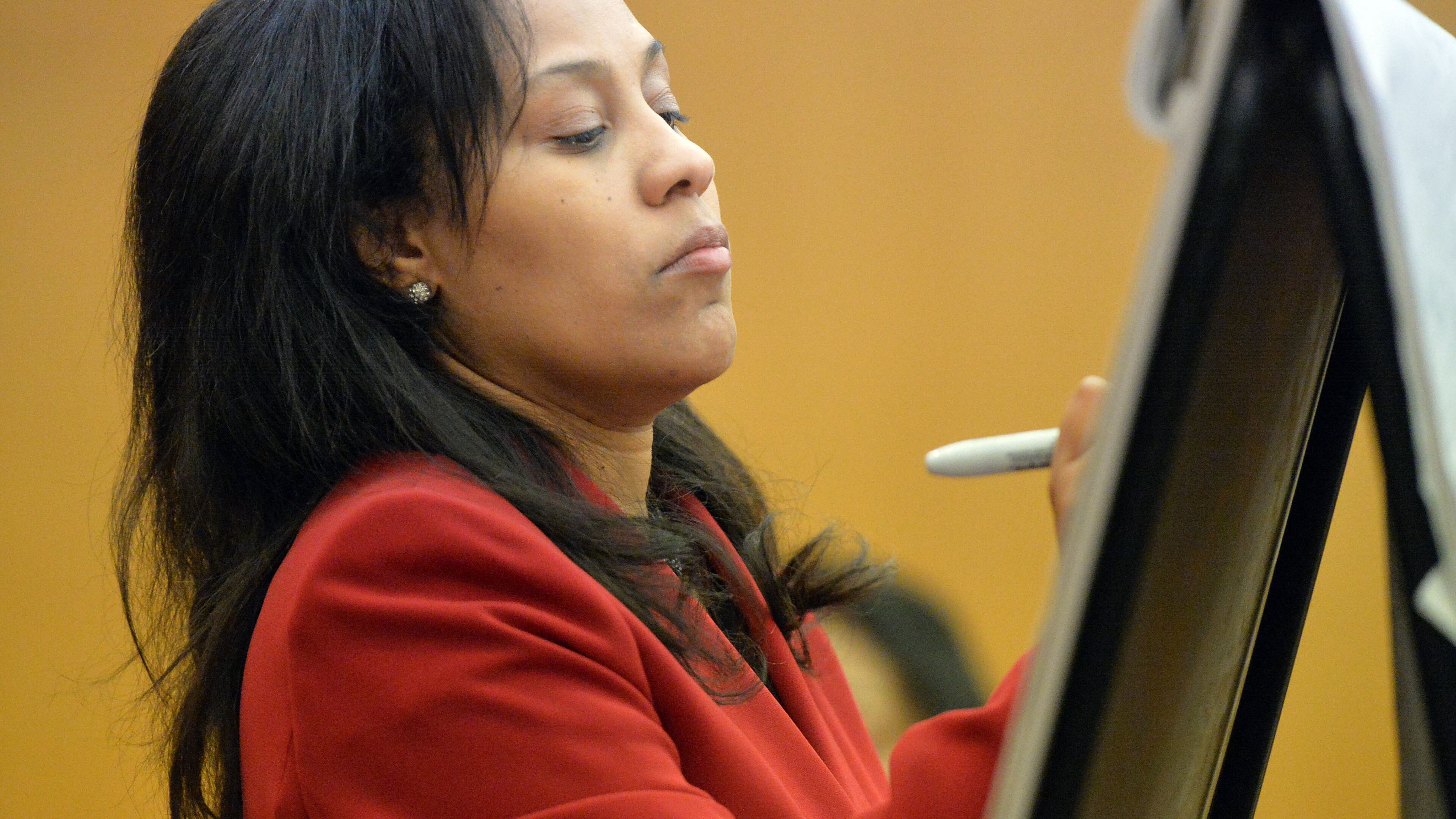 Fulton County Chief Senior Assistant DA Fani Willis writes on a chart as she questions prosecution witness Sharron Pitts on Wednesday. (Kent D. Johnson, Atlanta Journal-Constitution)