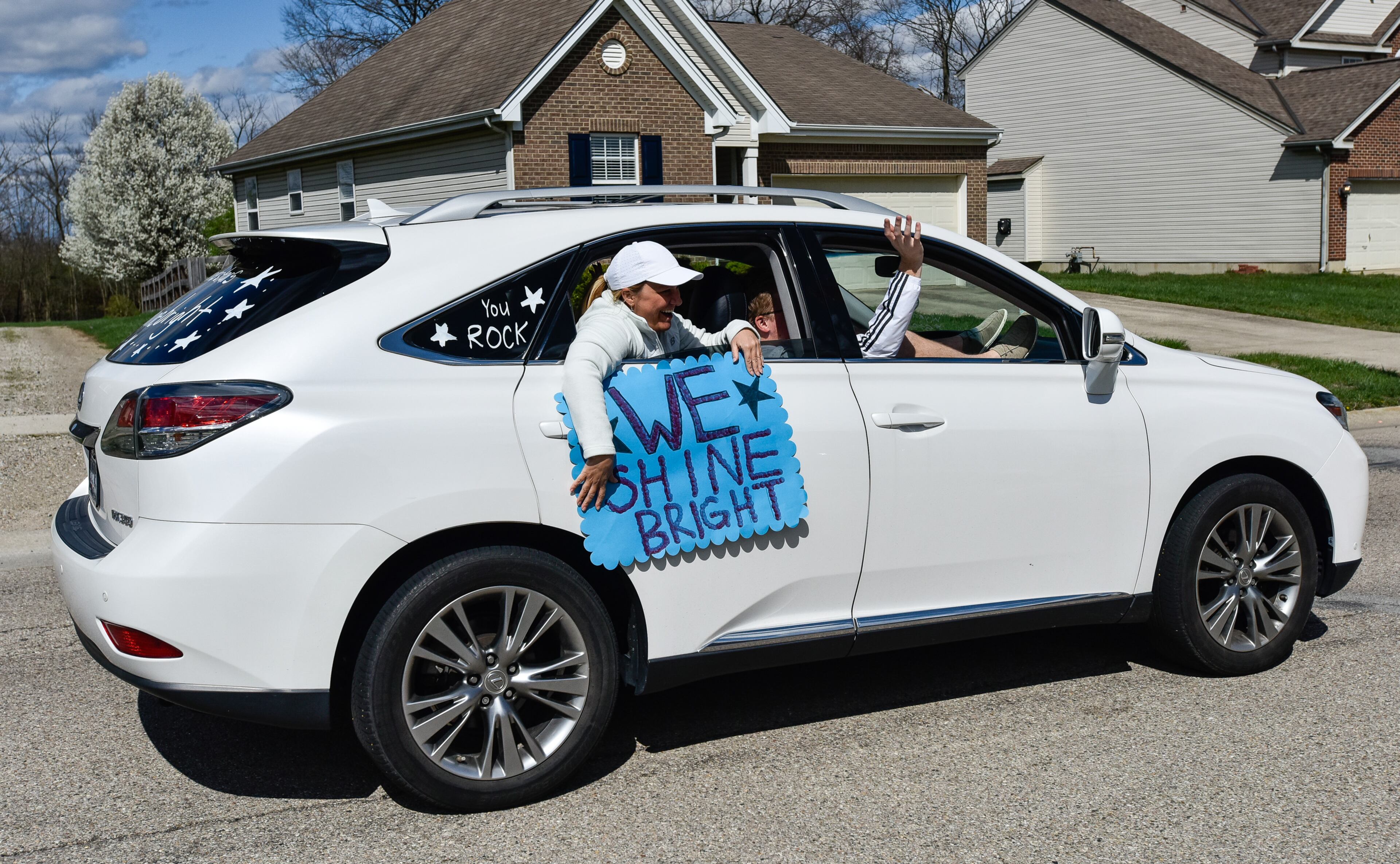 Teacher from Lakota's Wyandot Early Childhood School formed a caravan to drive around the neighborhoods to honk and wave to students as a way to show they are thinking of them during their time out of school due to the coronavirus pandemic. Teachers from multiple Lakota schools did the same thing around Liberty and West Chester Townships. NICK GRAHAM / STAFF