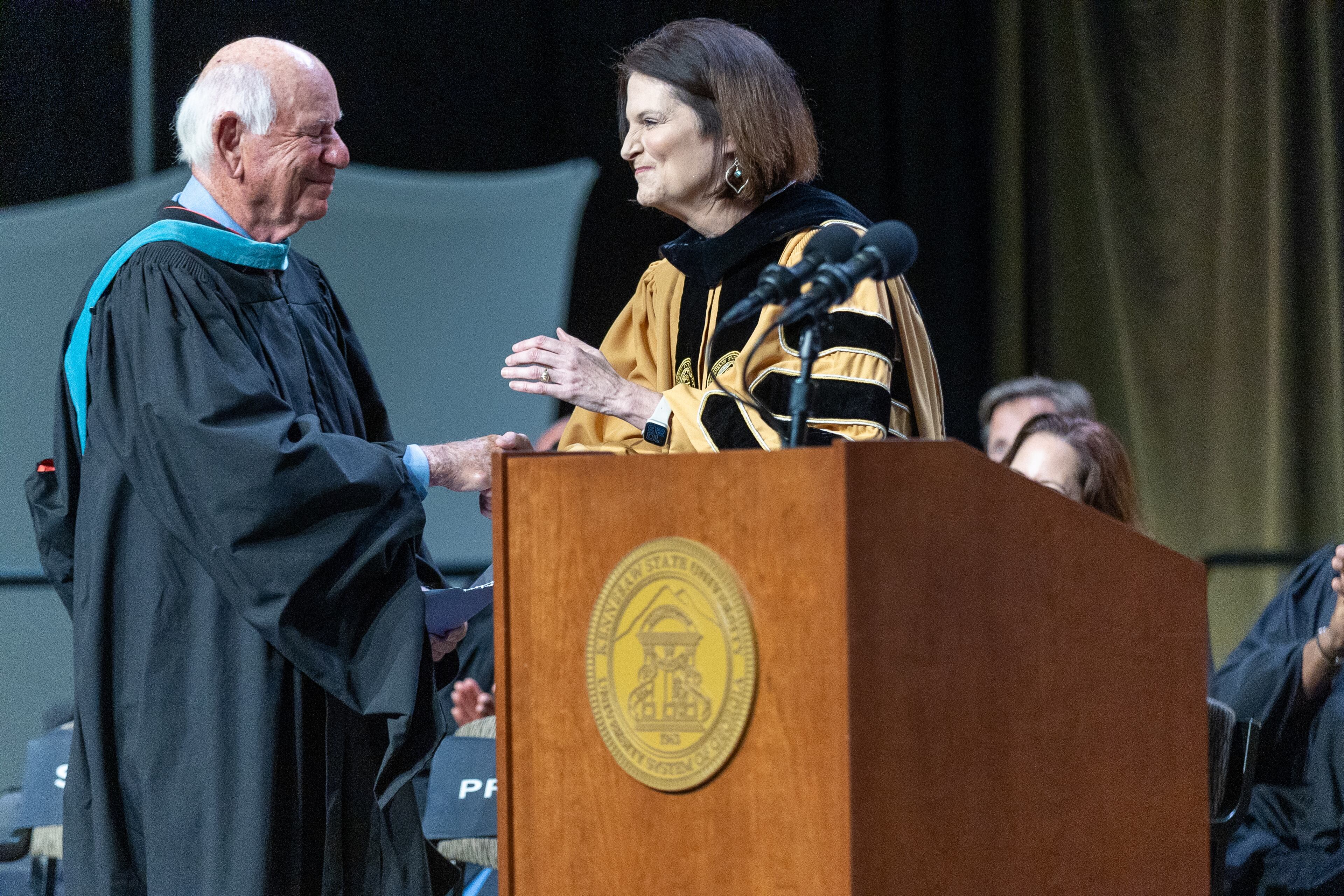 President Kathy S. Schwaig introduces commencement Speaker Michael A. Leven during the commencement ceremony for the College of Business at Kennesaw State University on Tuesday, May 7, 2014. (Steve Schaefer / AJC)