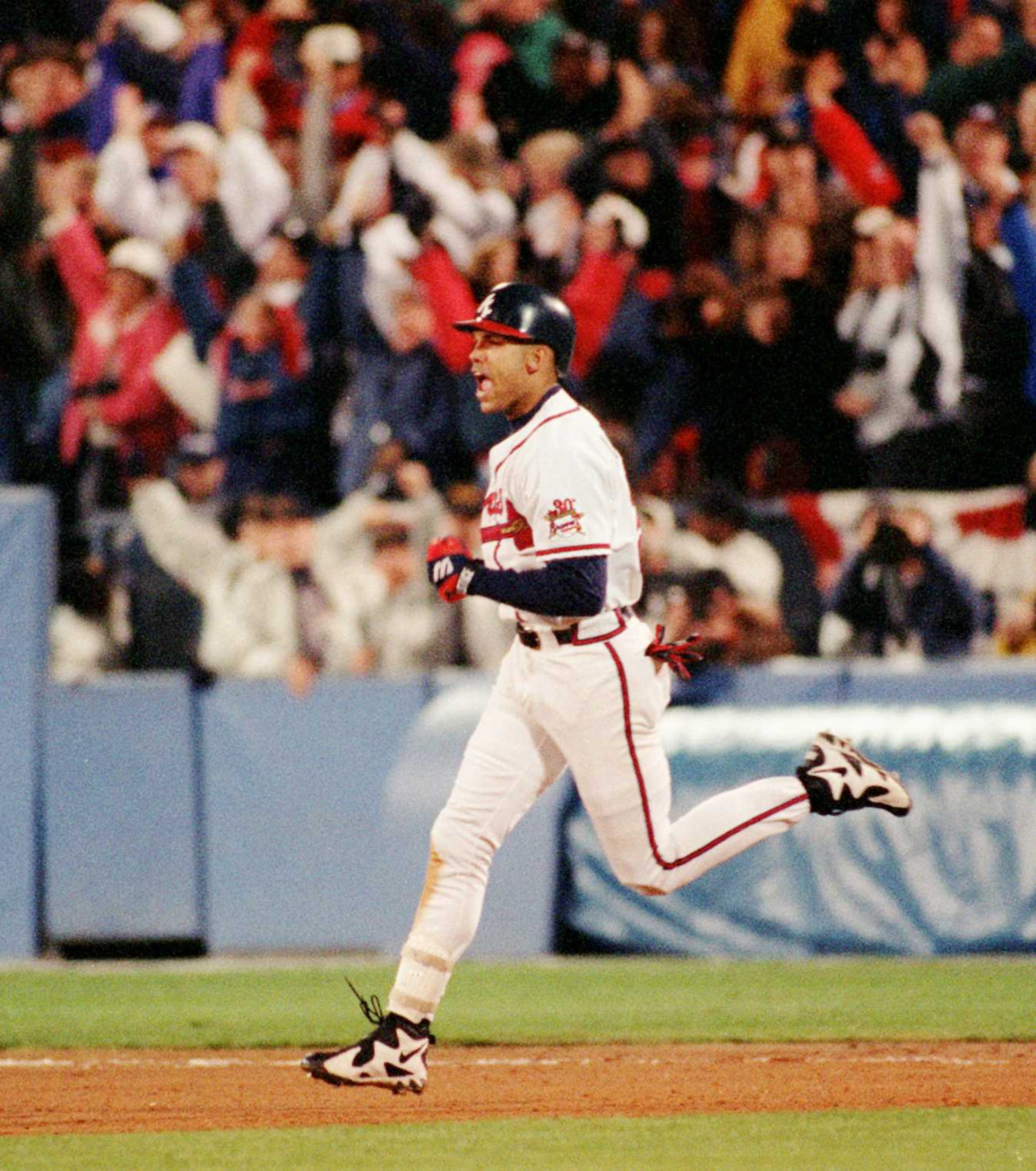 Braves right fielder David Justice yells as he rounds the bases after his solor homer in the sixth inning of Game Six of the World Series at Atlanta Fulton County Stadium, Saturday. Oct. 28, 1995.