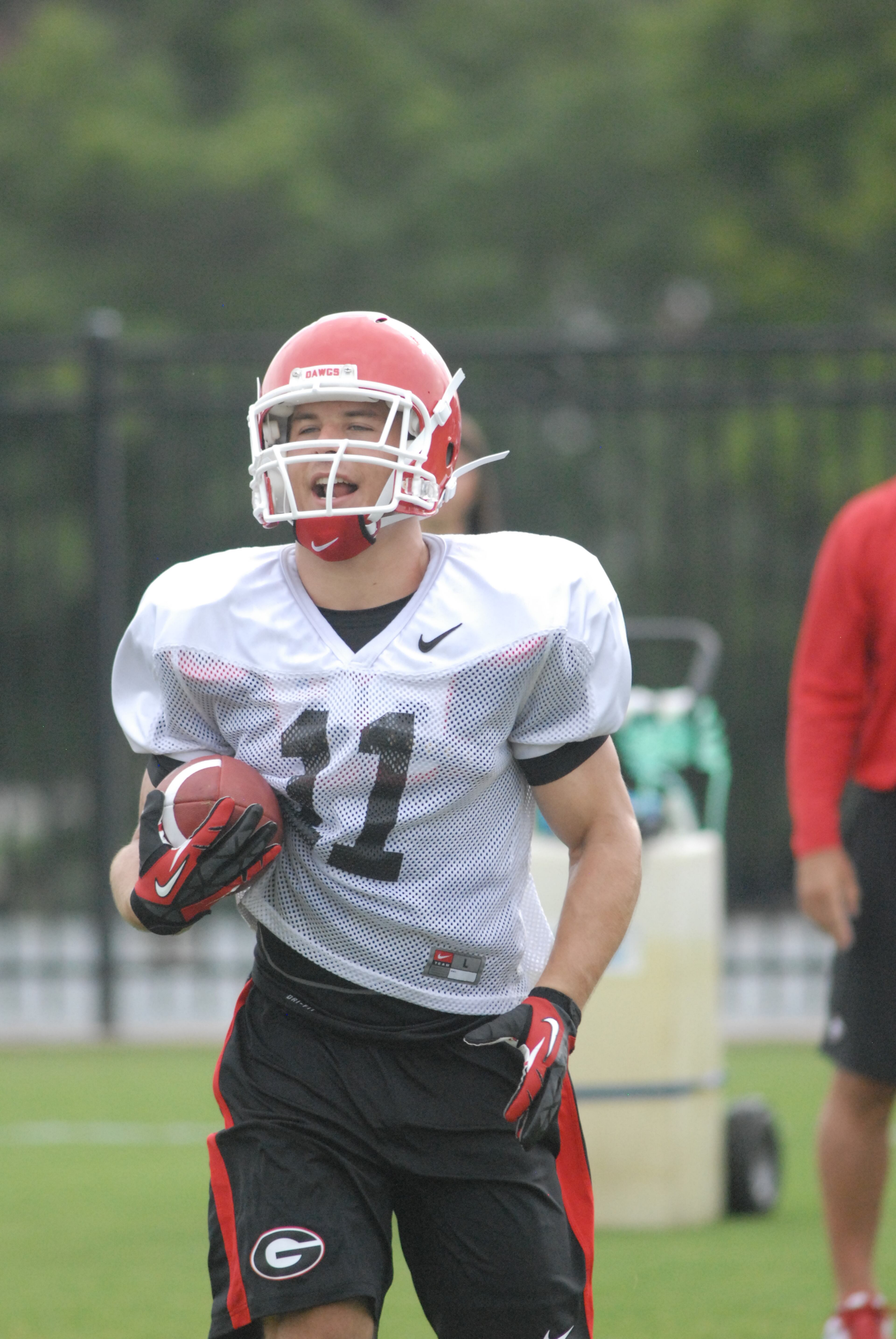 Free safety Connor Norman (11) runs with the football during Georgia's practice Thursday, Aug. 8, 2013, in Athens, Ga. (Photo by Steven Colquitt)