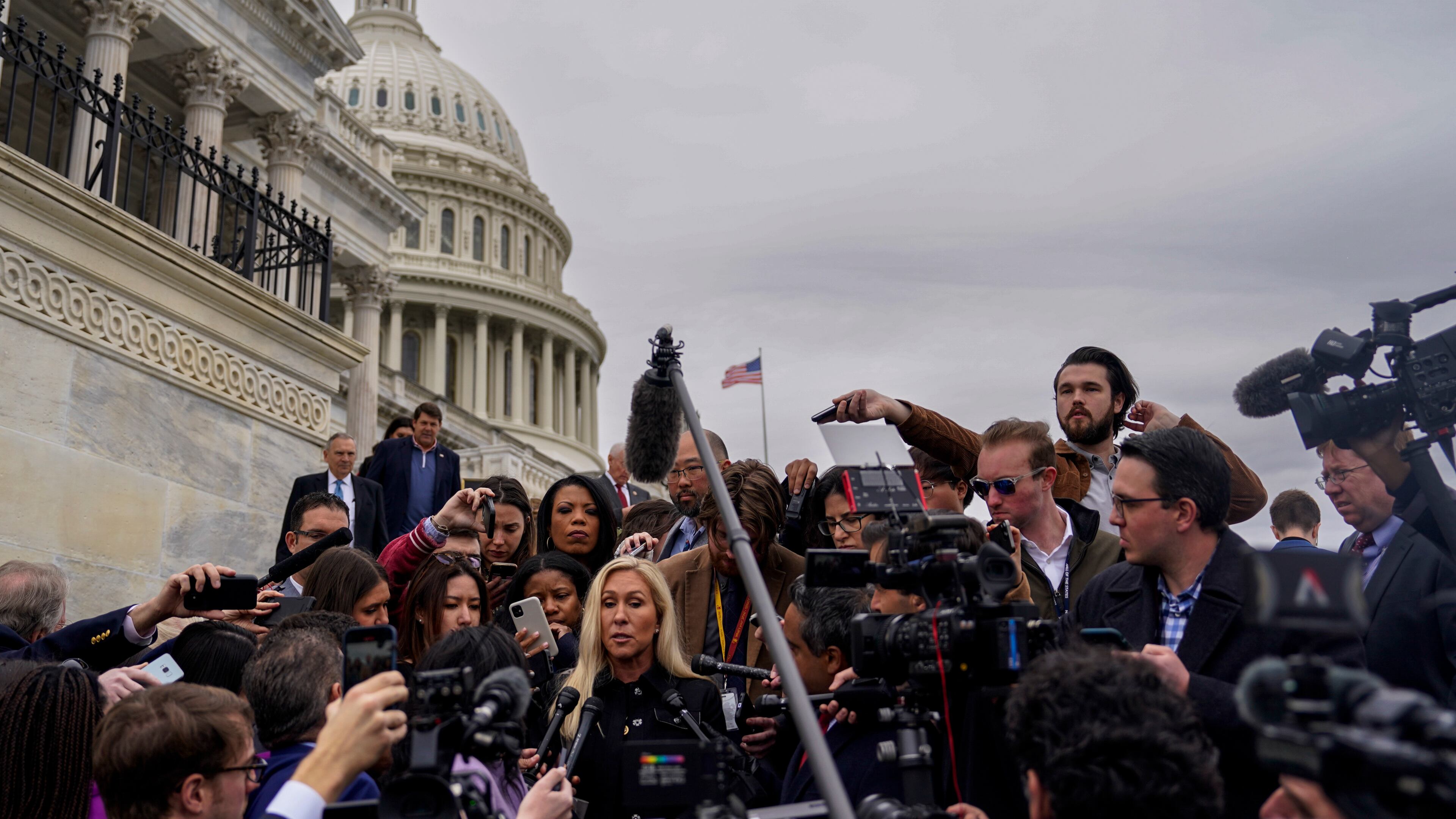 Rep. Marjorie Taylor Greene (R-Ga.) speaks to reporters on the steps of the House on Capitol Hill in Washington, March 22, 2024. Greene on Friday took the first step toward ousting House Speaker Mike Johnson, filing a resolution calling for his removal after he pushed through a $1.2 trillion bipartisan spending bill that enraged the hard right. (Kent Nishimura/The New York Times)