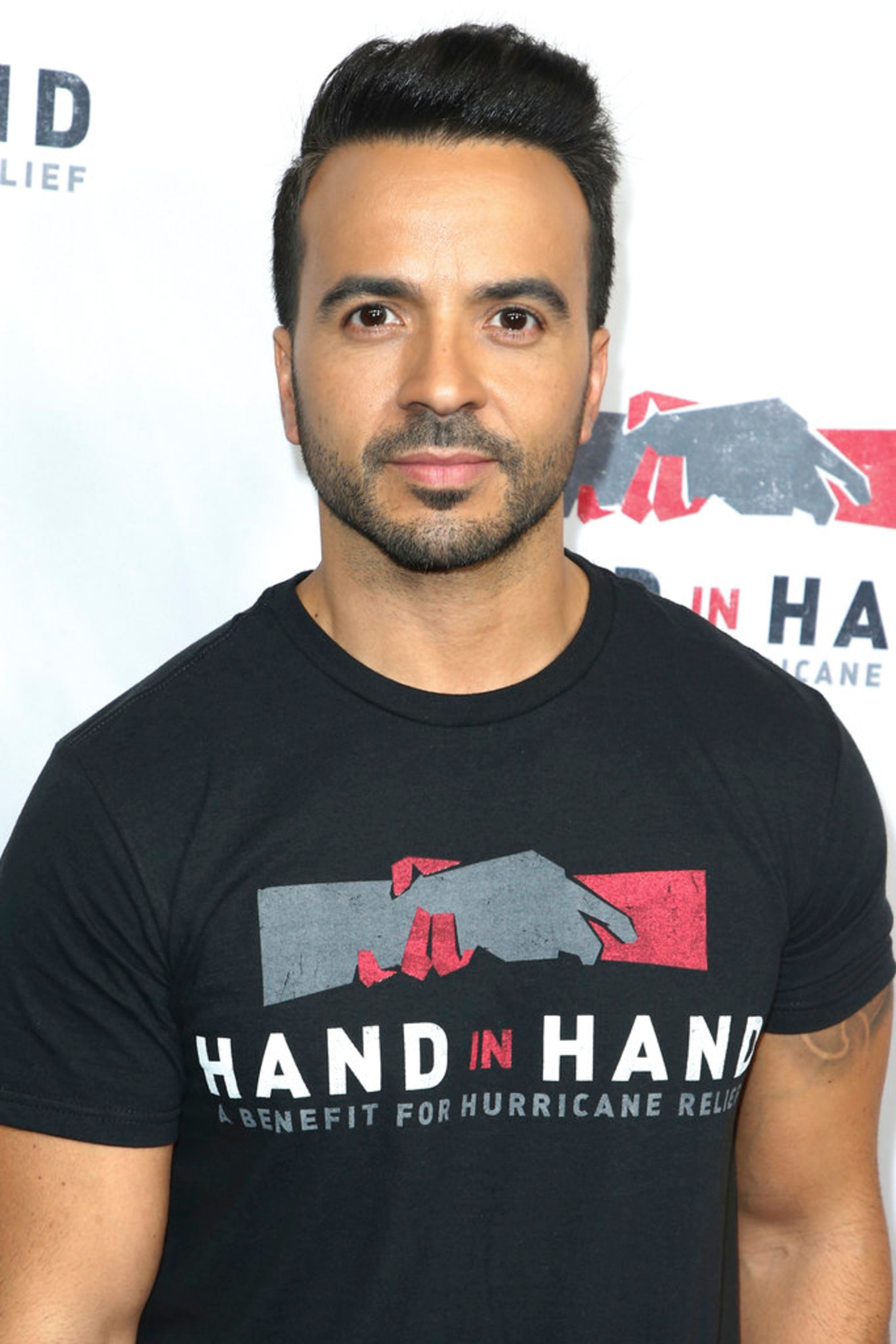 Luis Fonsi attends the Hand in Hand: A Benefit for Hurricane Harvey Relief held at Universal Studios Back Lot on Tuesday, Sept. 12, 2017 in Universal City, Calif. (Photo by John Salangsang/Invision/AP)