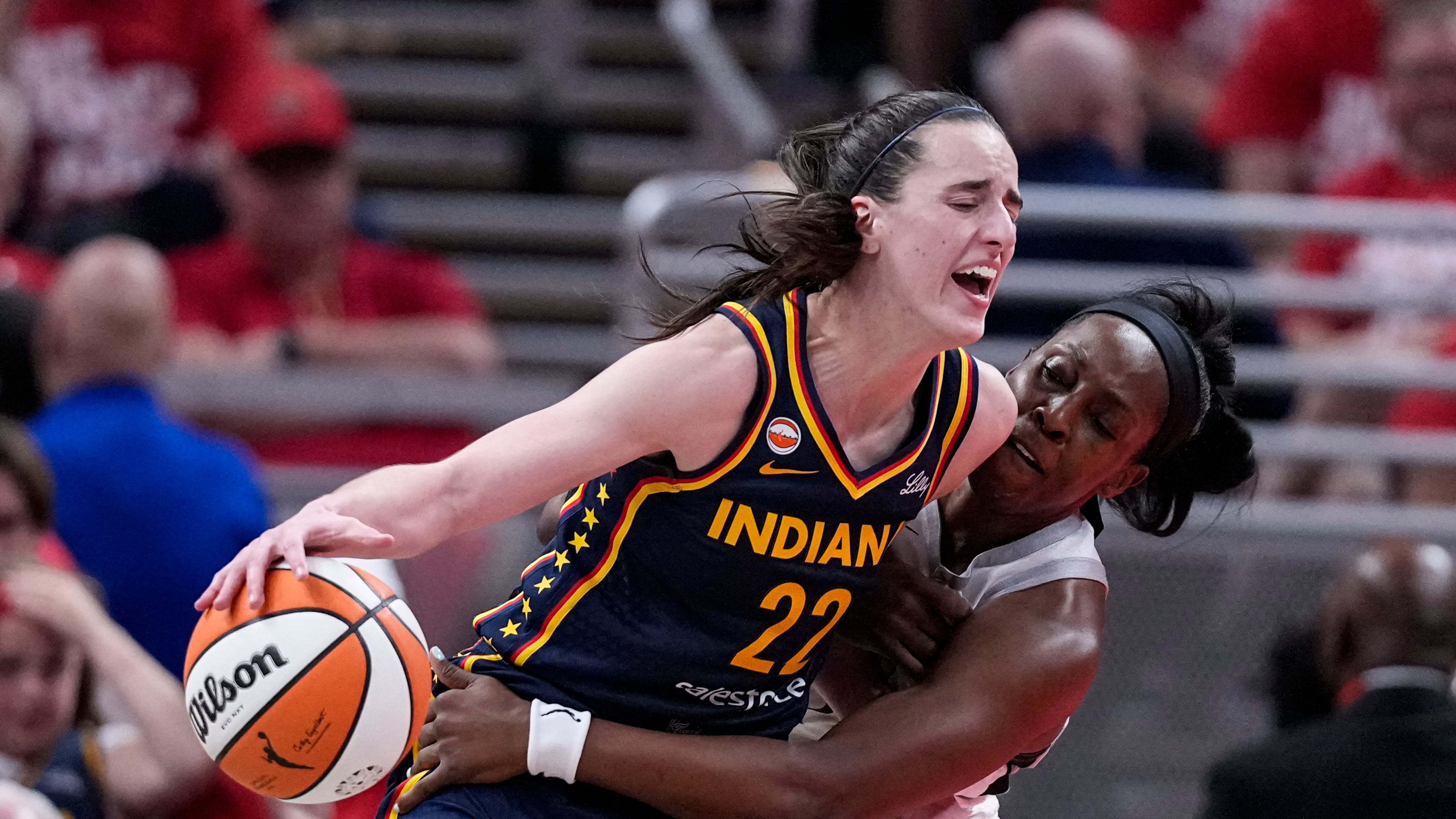 Las Vegas Aces guard Chelsea Gray, right, defends Indiana Fever guard Caitlin Clark (22) during the second half in Game 2 of a WNBA basketball first-round playoff series in Indianapolis, Tuesday, Sept. 29, 2026. (AP Photo/Michael Conroy)