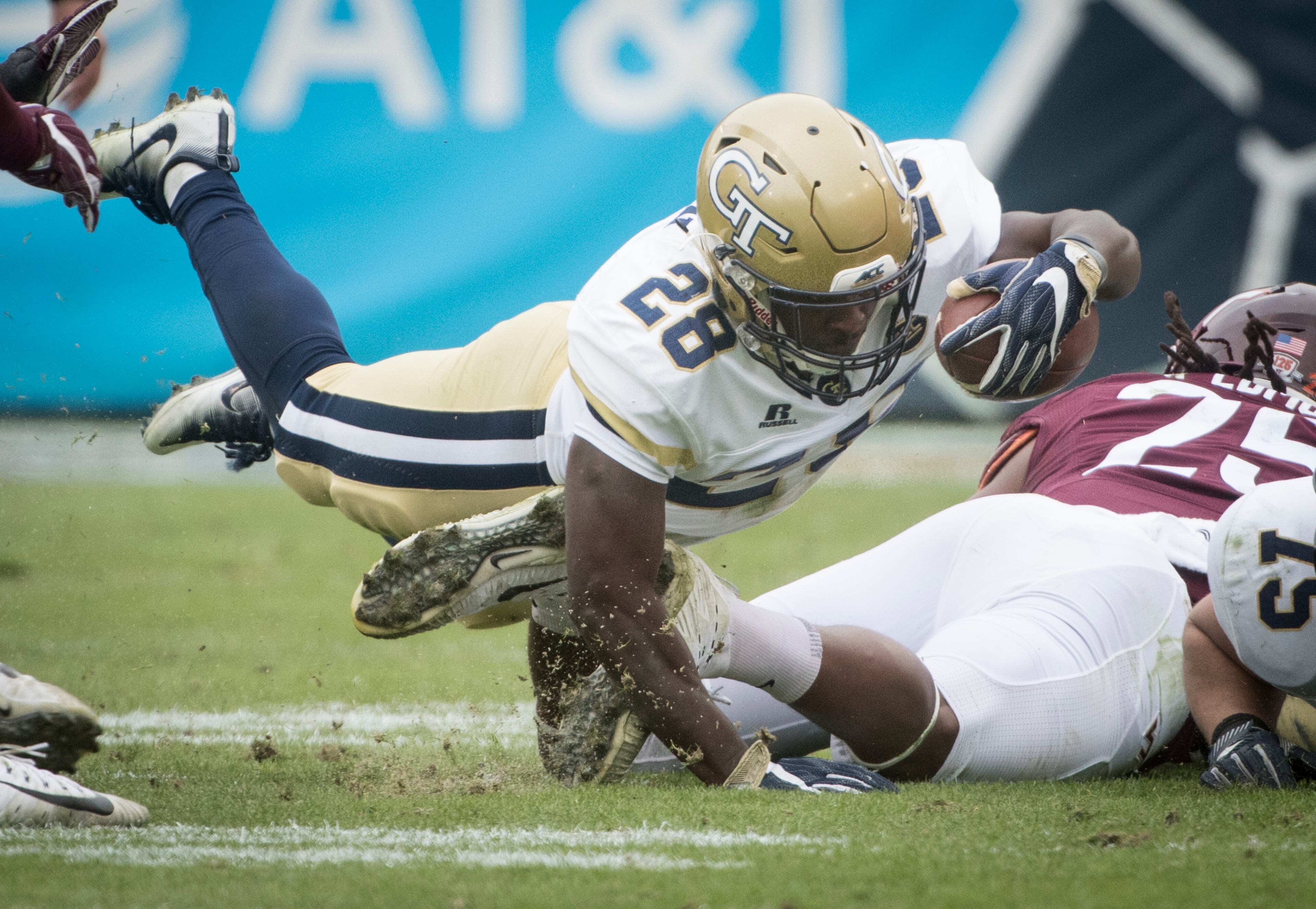 Georgia Tech running back J.J. Green (28) dives across dives for yardage against Virginia Tech during the first half of a football game on Saturday, Nov.11, 2017, in Atlanta. (Photo/John Amis)