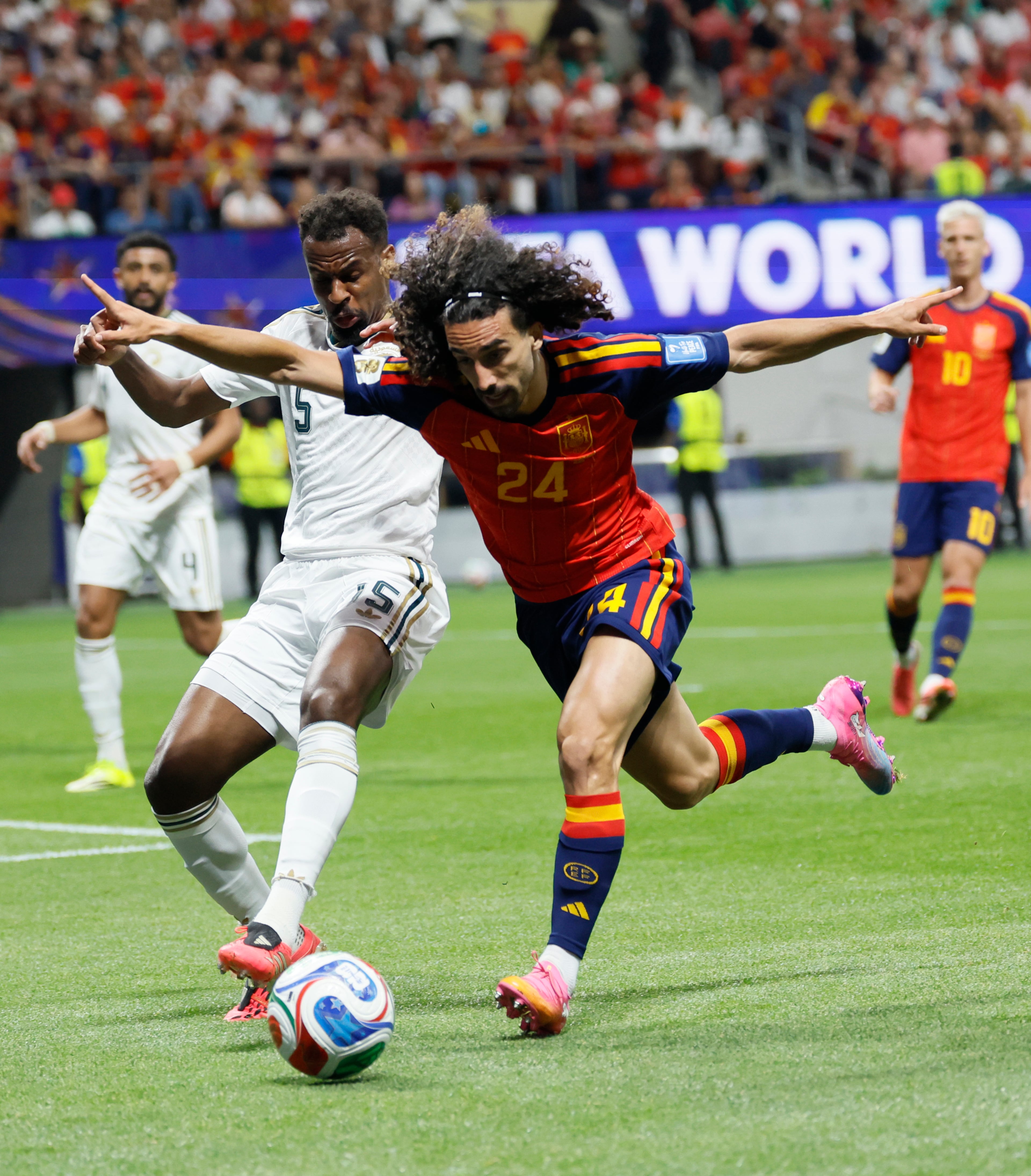 Spain's Marc Cucurella (right) battles Saudi Arabia's Abdullah Al-Khaibari during the first half of the Spain vs. Saudi Arabia World Cup match Sunday, June 21, 2026, at Atlanta Stadium. (Miguel Martinez/AJC)
