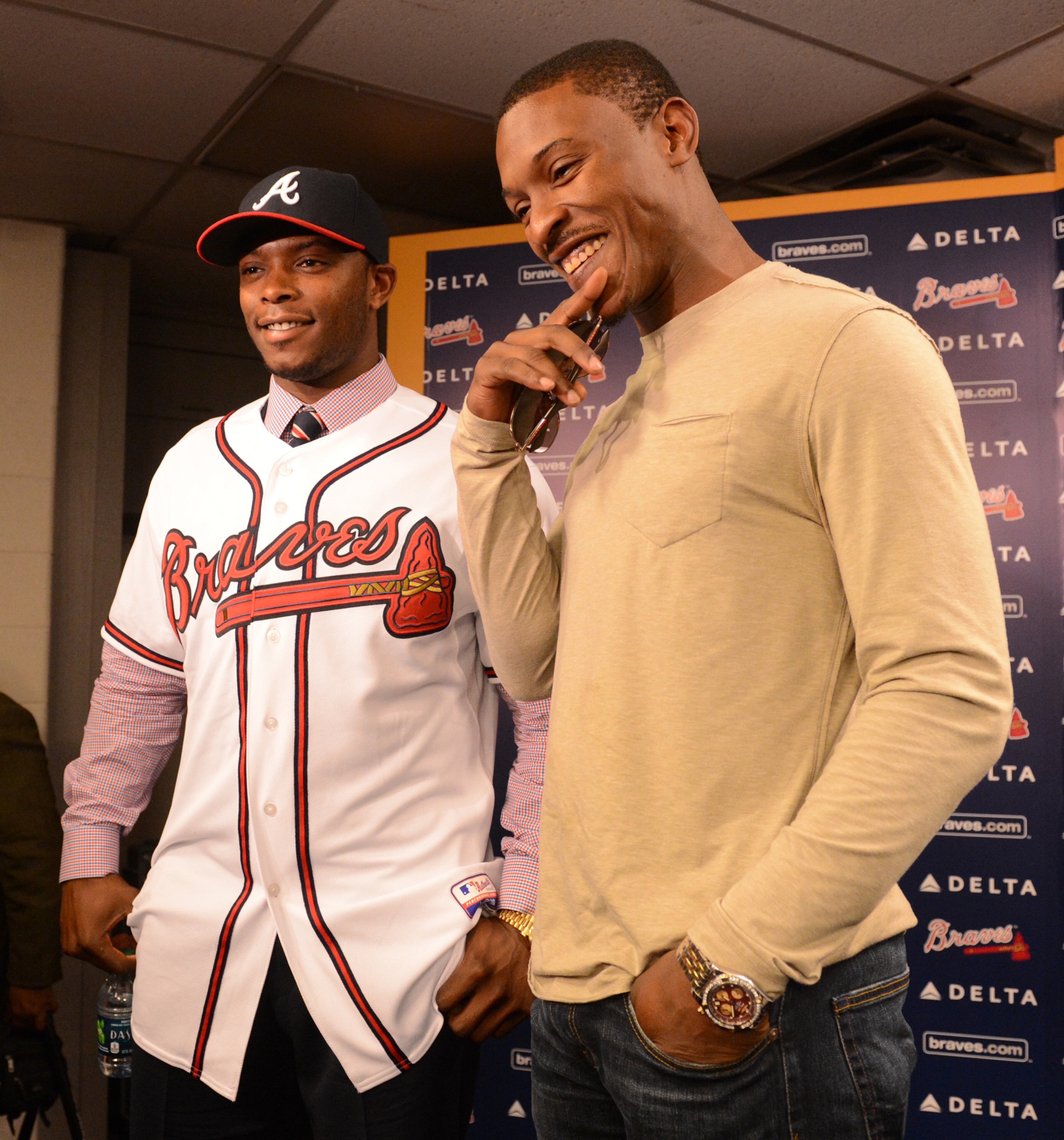 Justin Upton smiles as he stands next to his brother, B.J. Upton during the Atlanta Braves press conference on Tuesday, January 29, 2013. The Atlanta Braves introduced Justin today but signed B.J. earlier this year. . JOHNNY CRAWFORD / JCRAWFORD@AJC.COM