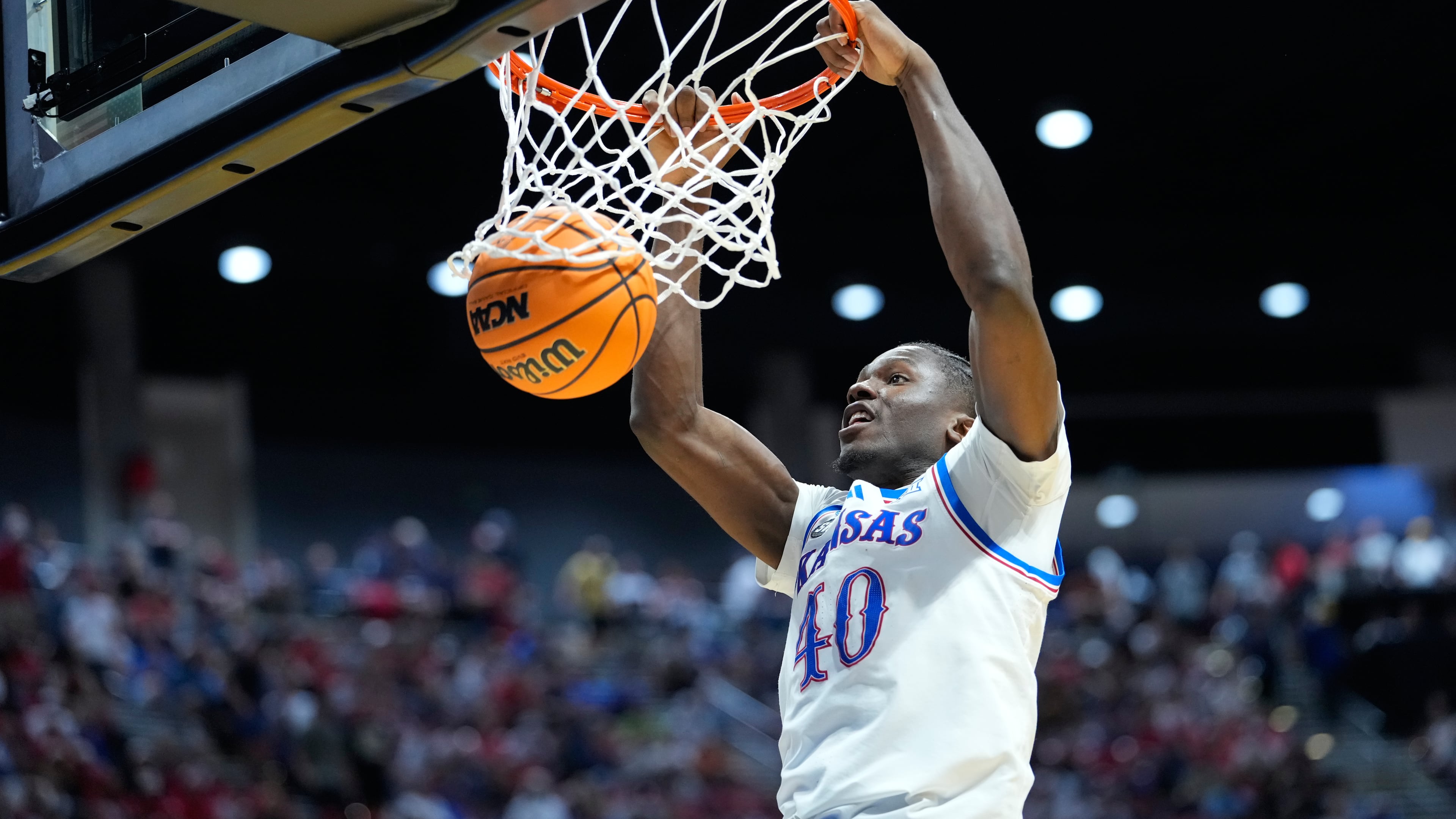 Kansas forward Flory Bidunga dunks against St. John's during the second half of a game in the second round of the NCAA college basketball tournament Sunday, March 22, 2026, in San Diego. (AP Photo/Mark J. Terrill)
