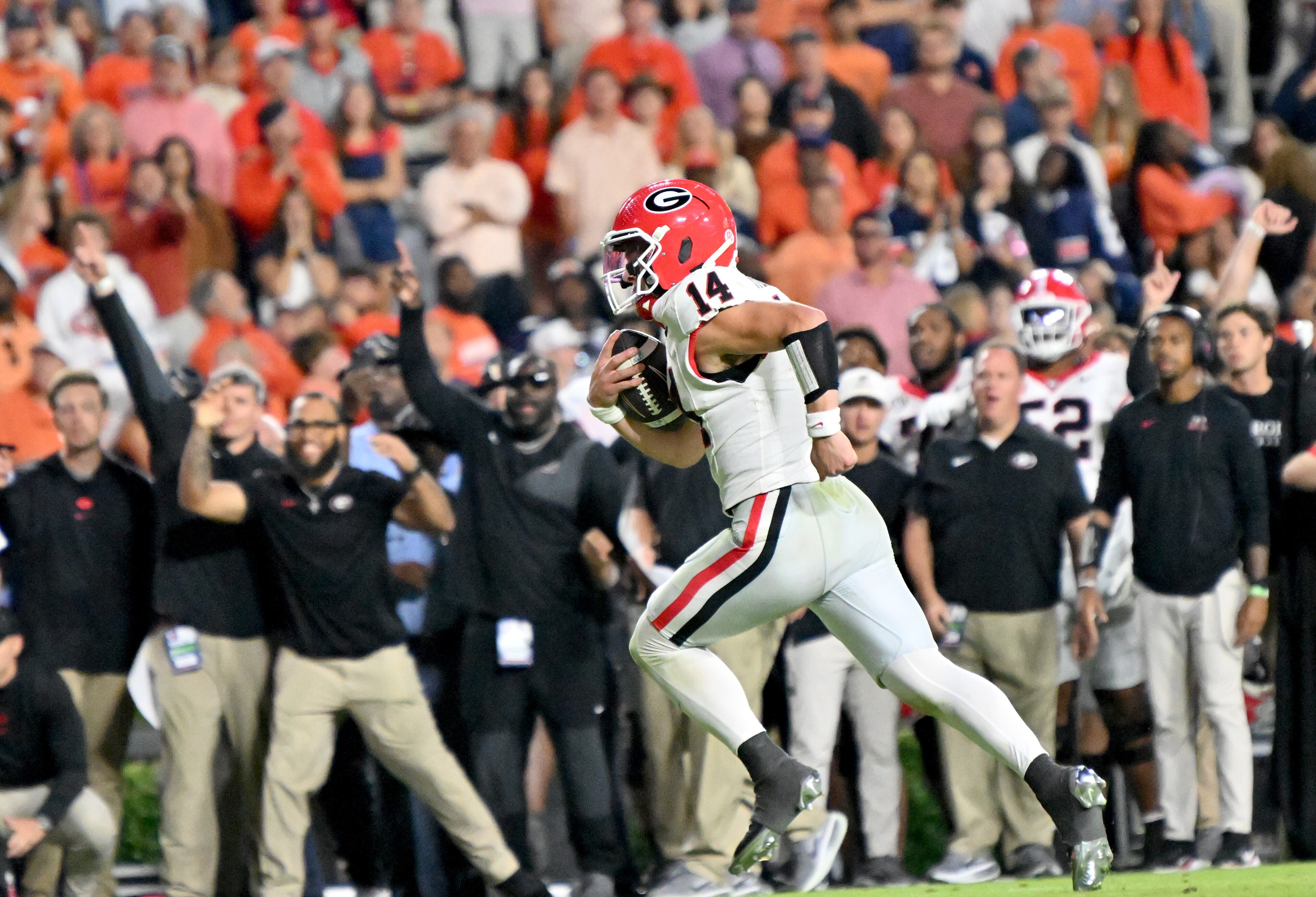 Georgia quarterback Gunner Stockton (14) runs for a touchdown during the second half in a NCAA college football game at Jordan-Hare Stadium, Saturday, October 11, 2025, in Auburn, Ala. Georgia won 20-10 overAuburn. (Hyosub Shin / AJC)