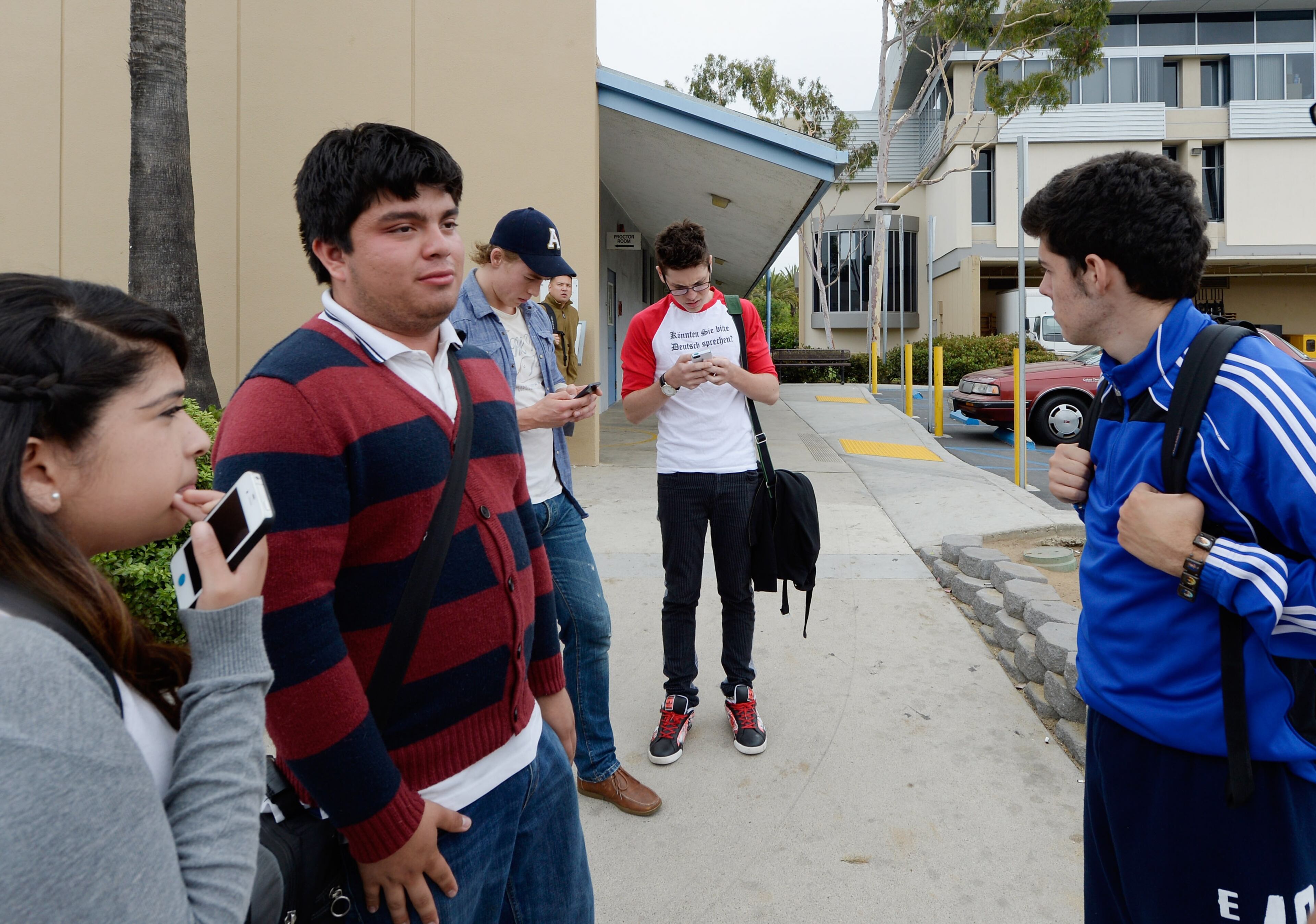 SANTA MONICA, CA - JUNE 07: Students wait outside after after multiple shootings were reported on the campus of Santa Monica College June 7, 2013 in Santa Monica, California. According to reports, at least one person has died, four people hospitalized, and a suspect was taken into custody. (Photo by Kevork Djansezian/Getty Images)