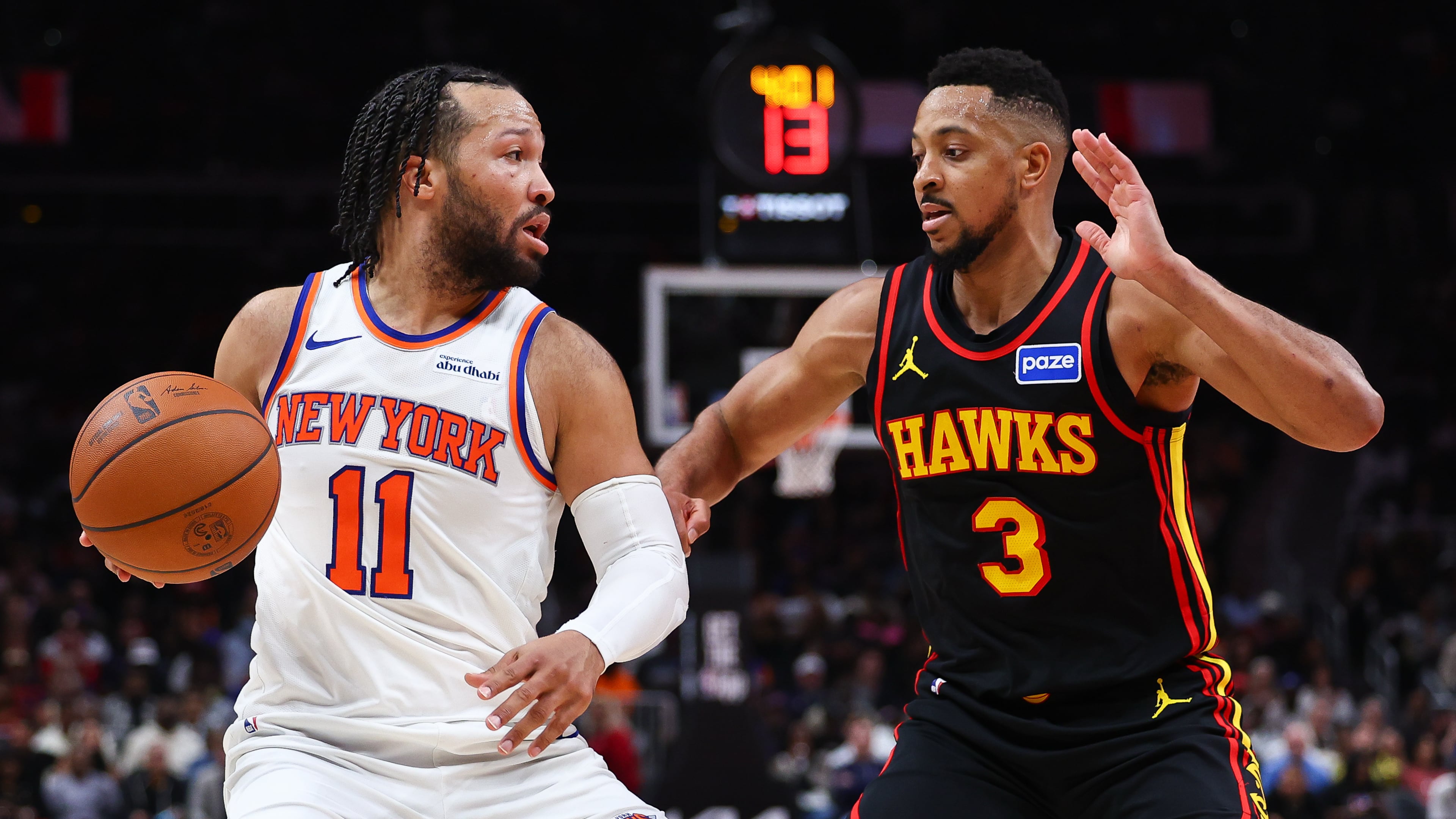 New York Knicks guard Jalen Brunson (11) dribbles against Atlanta Hawks guard CJ McCollum (3) during the second half of an NBA basketball game, Monday, April 6, 2026, in Atlanta. (AP Photo/Colin Hubbard)