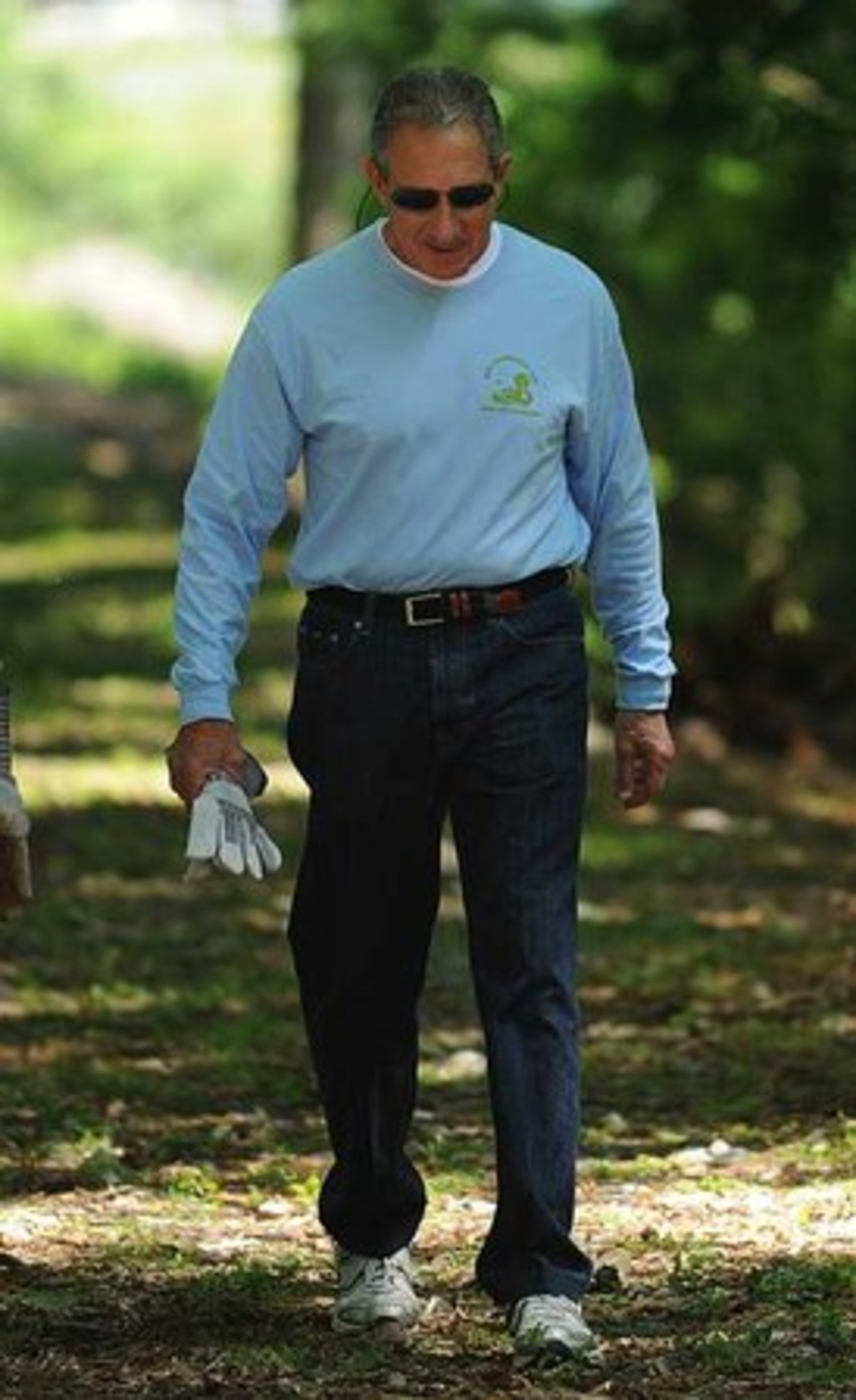 Arthur Blank himself lends a hand in the trail clean-up.