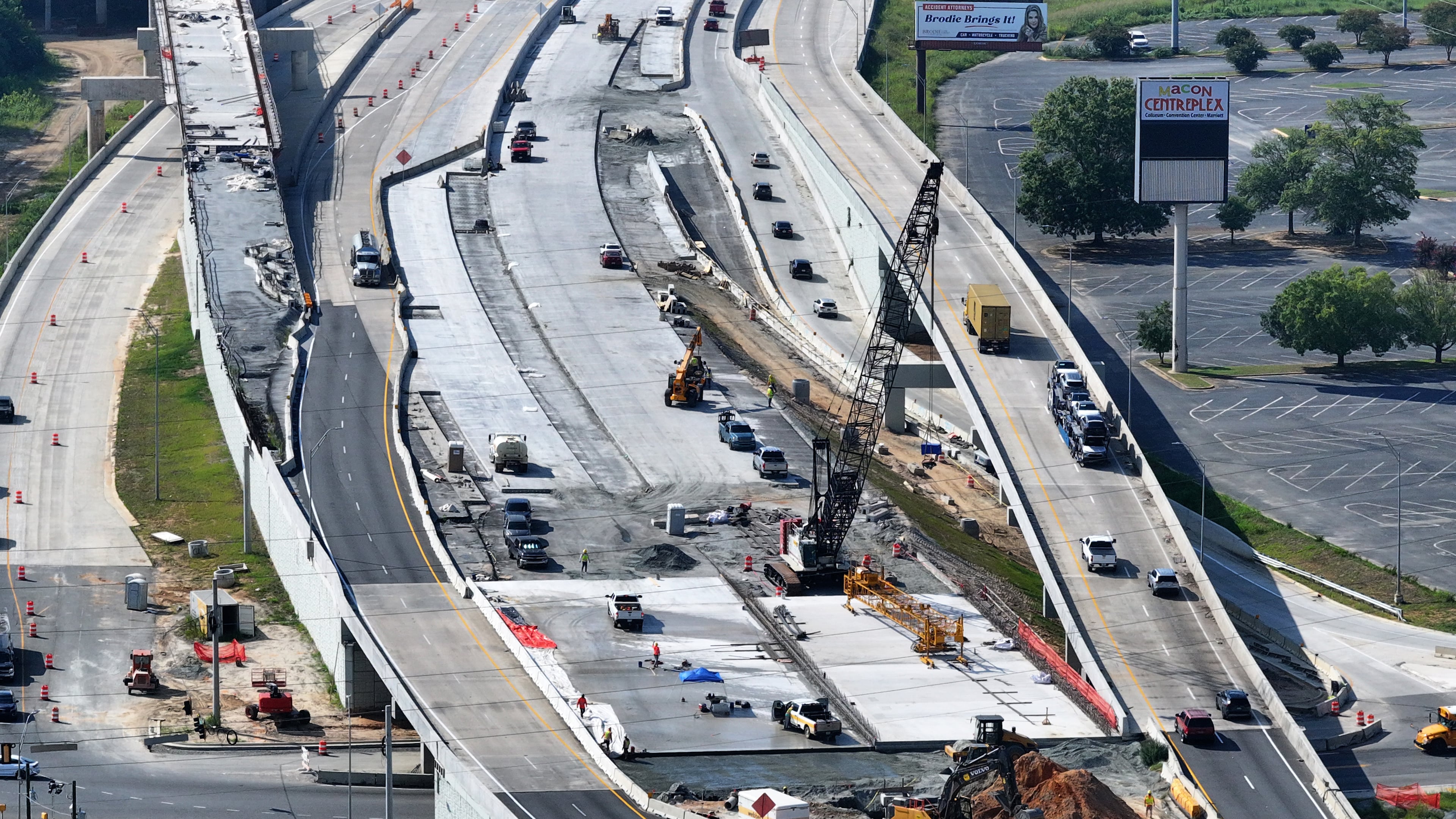 An aerial view of construction along I-16 near the Macon Coliseum, just east of the freeway's long-under-construction interchange at I-75. (Hyosub Shin/AJC)