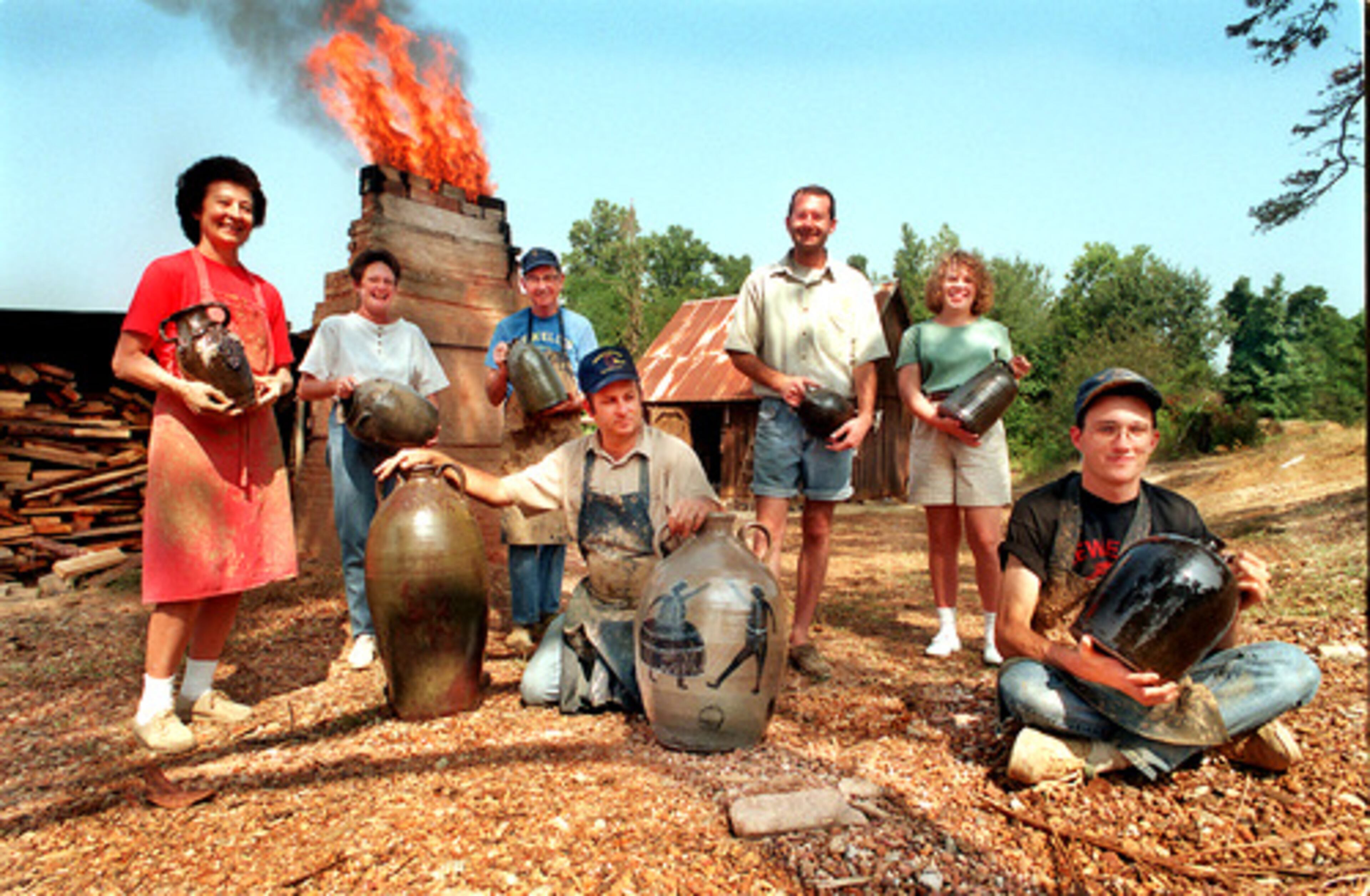 A Hewell family portrait taken in 1997. From left to right; Grace Hewell, Sandra Hewell, Harold Hewell, Chester Hewell (kneeling), Nathaniel Hewell, Amanda Hewell and Matthew Hewell (seated) outside their kiln.