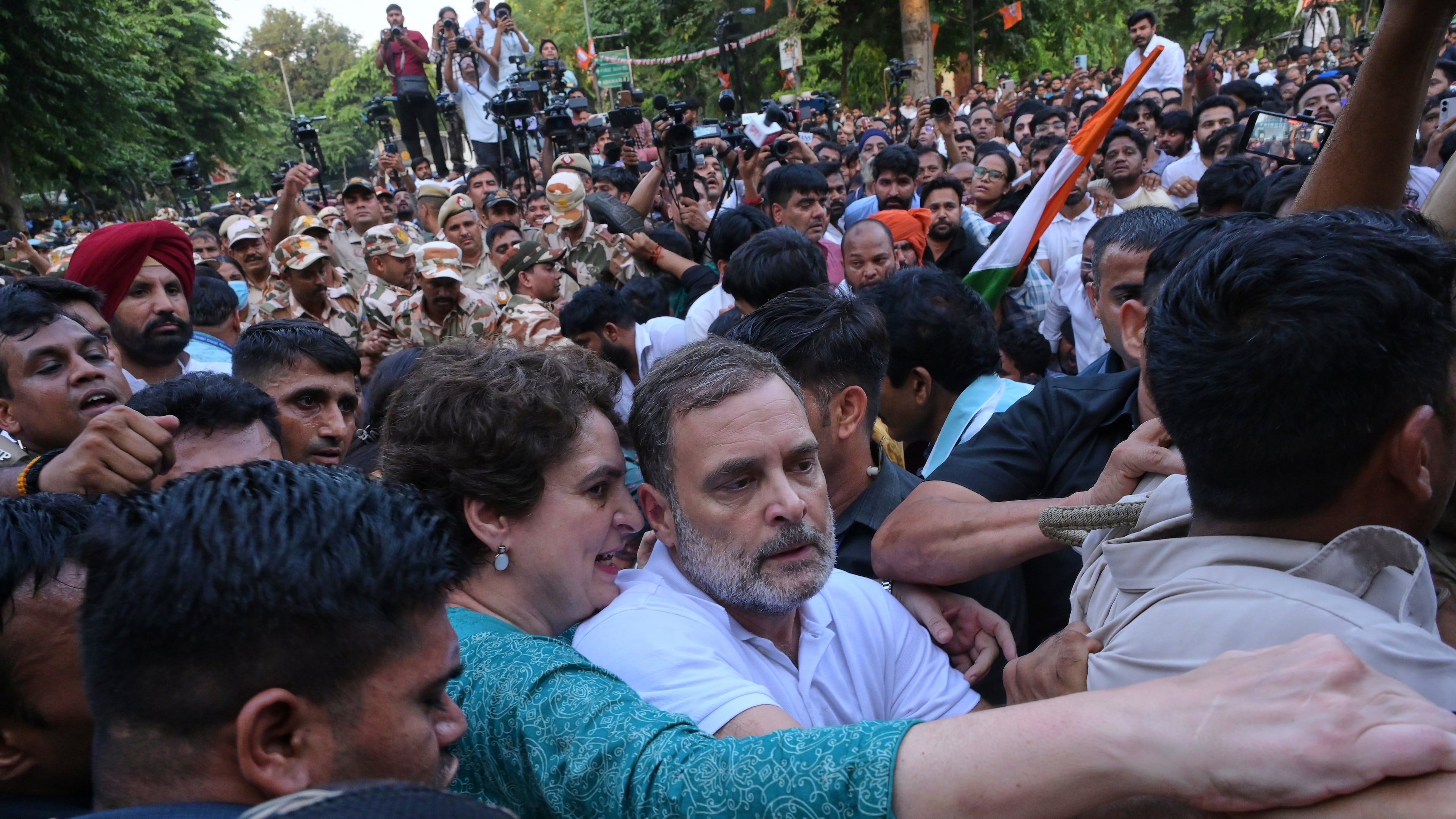 India's opposition Congress party leader Rahul Gandhi, center, and his sister, fellow lawmaker Priyanka Gandhi Vadra, jostle with police during a protest demanding the resignation of Chief Election Commissioner Gyanesh Kumar in New Delhi, India, Wednesday, Oct. 7, 2026. (AP Photo/Vipin)