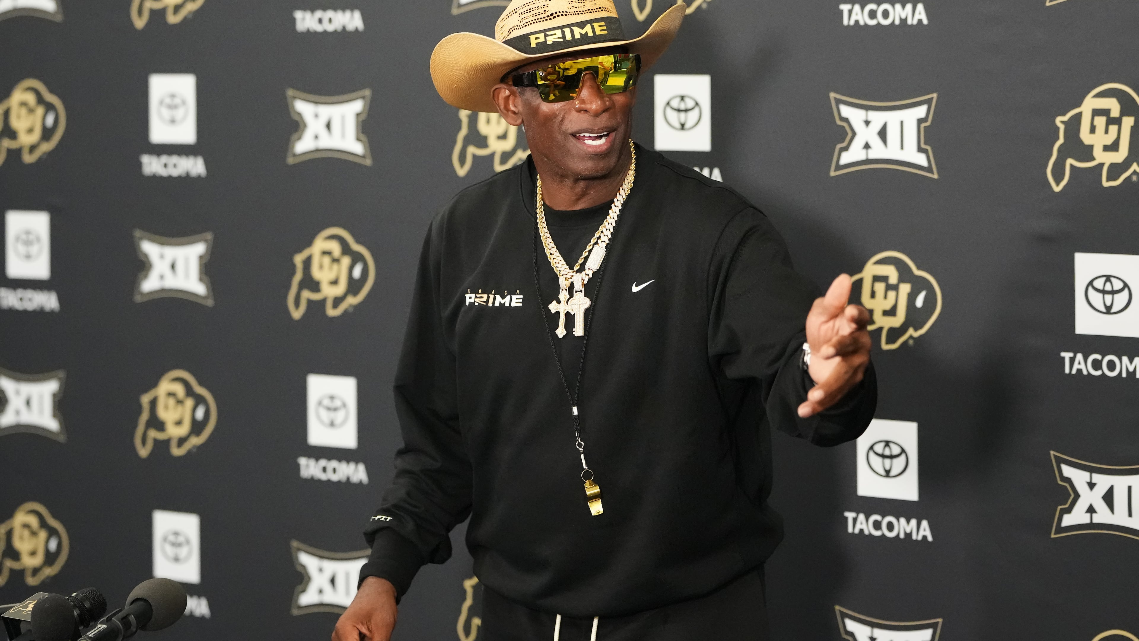Colorado head coach Deion Sanders talks to reporters after practice at an NCAA college football training camp in Fountain, Colo., Thursday, Aug. 6, 2026. (AP Photo/David Zalubowski)