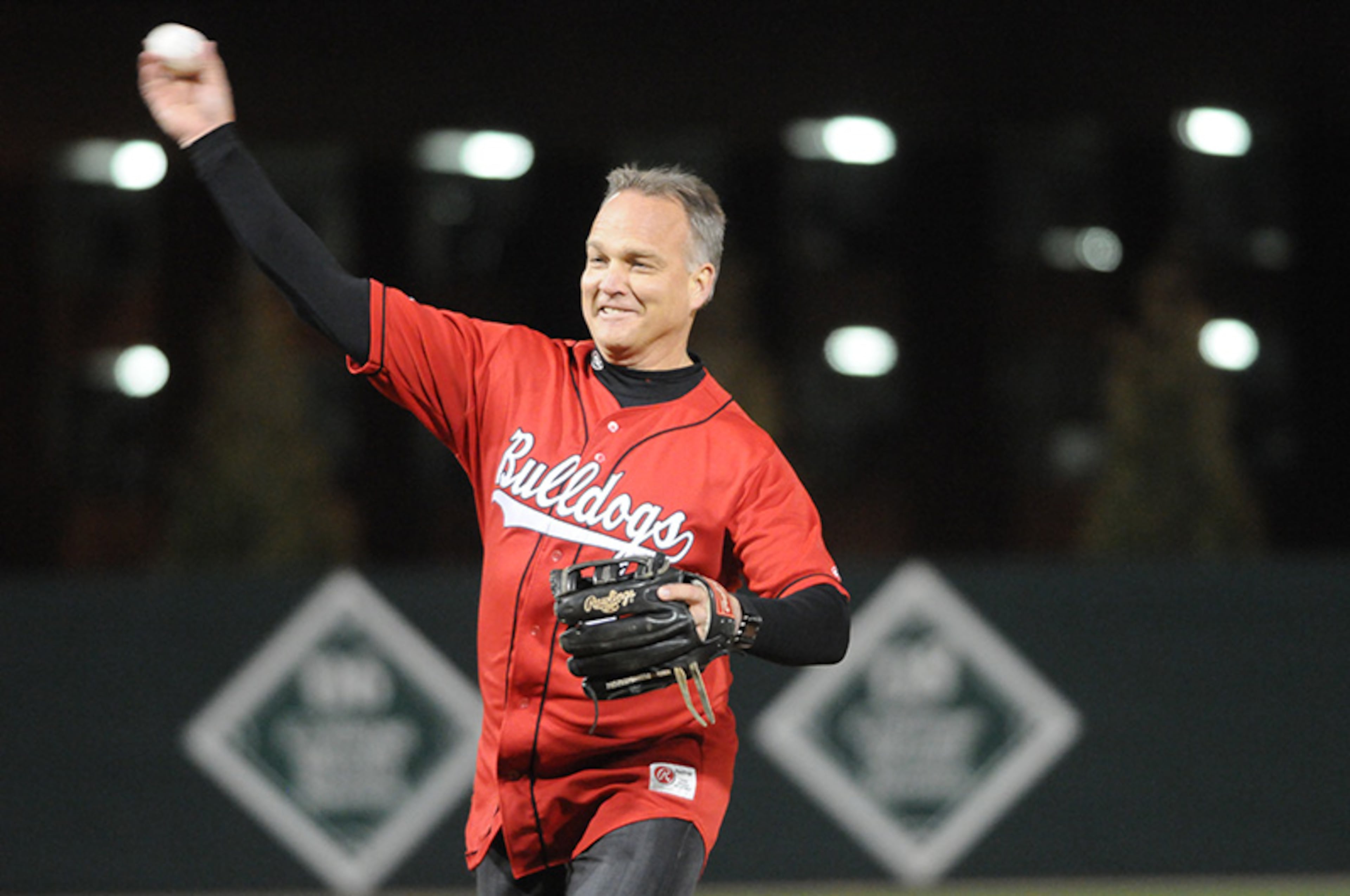 Georgia head football coach Mark Richt throws out the ceremonial first pitch before the Bulldogs' matchup against Georgia Tech on Tuesday, March 4, 2014, in Athens.