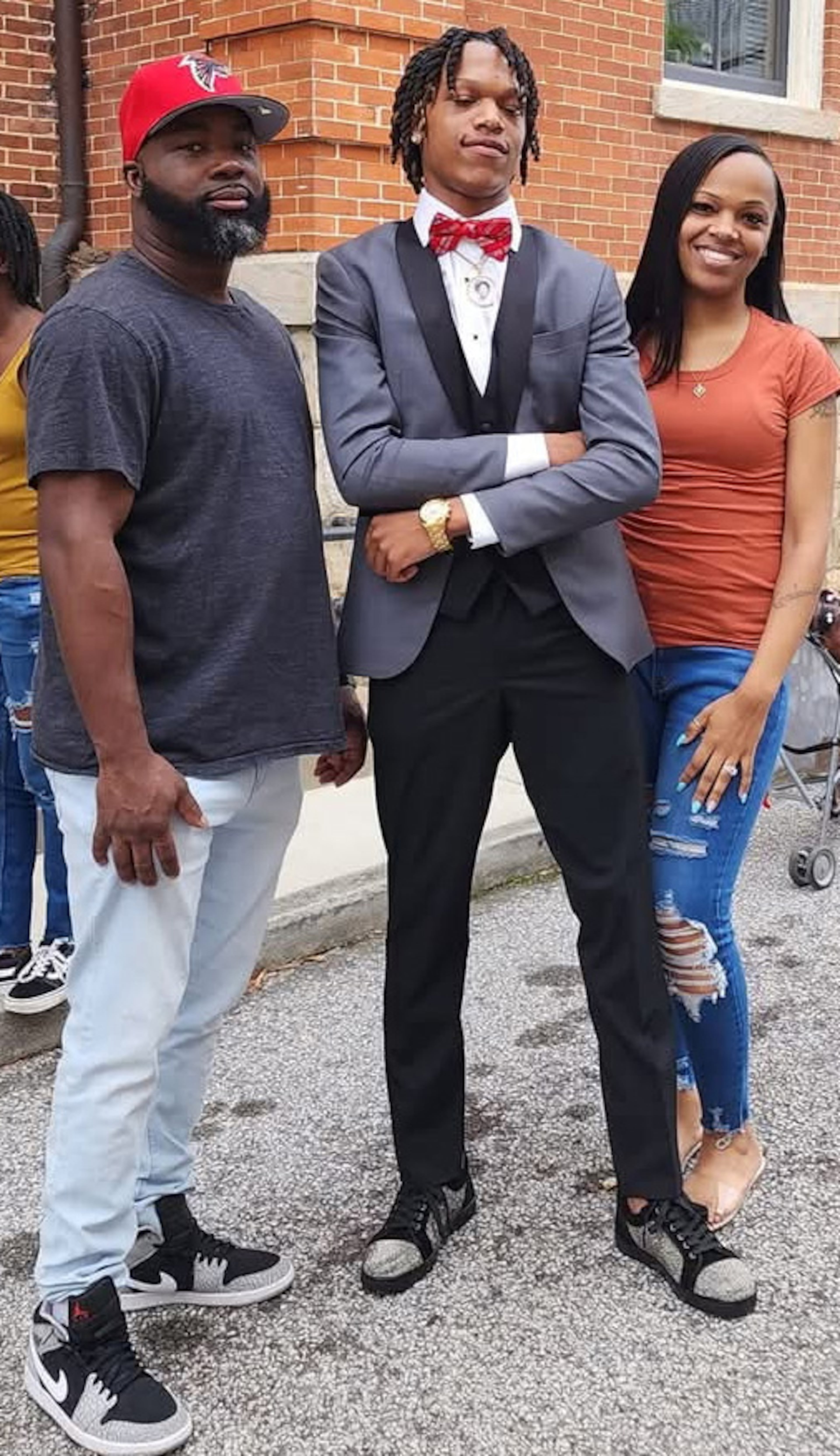 Kendarrius Spear (center) is shown with his stepfather, David Gay, and mother, Kennethia McKibben-Gay.