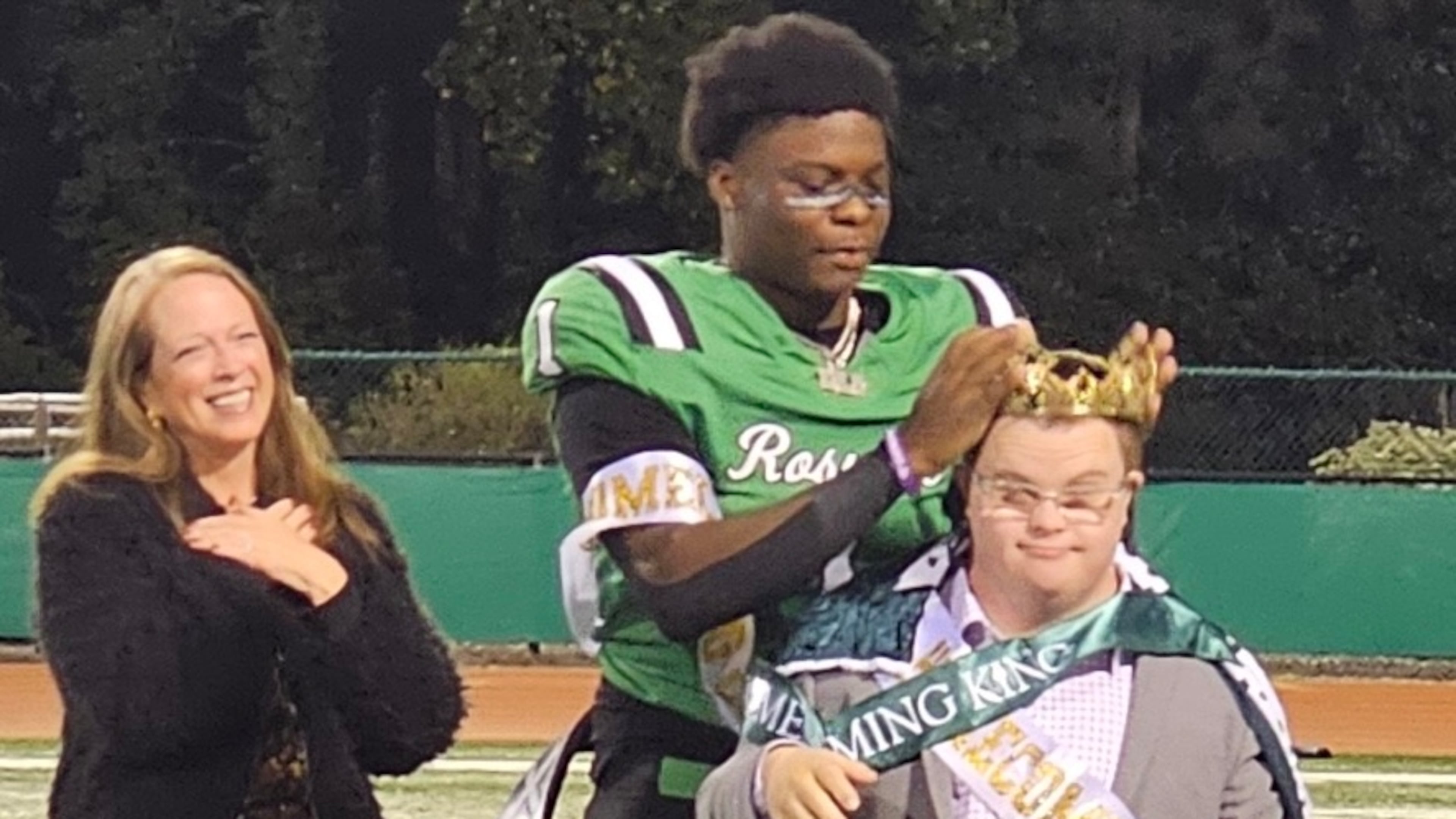 Roswell quarterback Trey Smith was named homecoming king and promptly redirected the honor to team student assistant Jake Jeffries. (Photo: Cassidy Windsor)