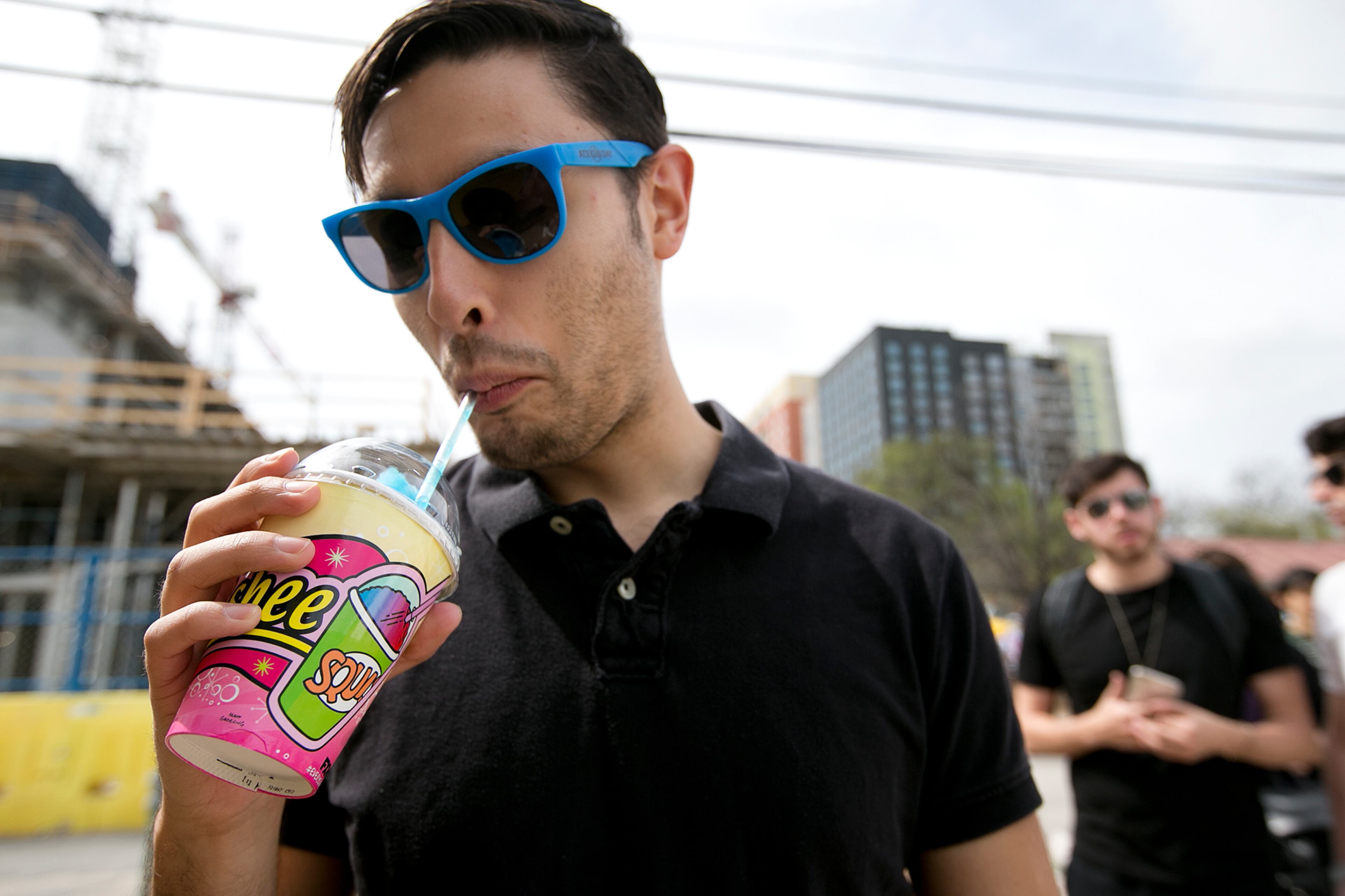 Diego Hernandez tries out his free squishee at the Simpsons Kwik-E-Mart Truck at South Bites Food during SXSW at the Austin Convention Center on Sunday, March 15, 2015. DEBORAH CANNON / AMERICAN-STATESMAN