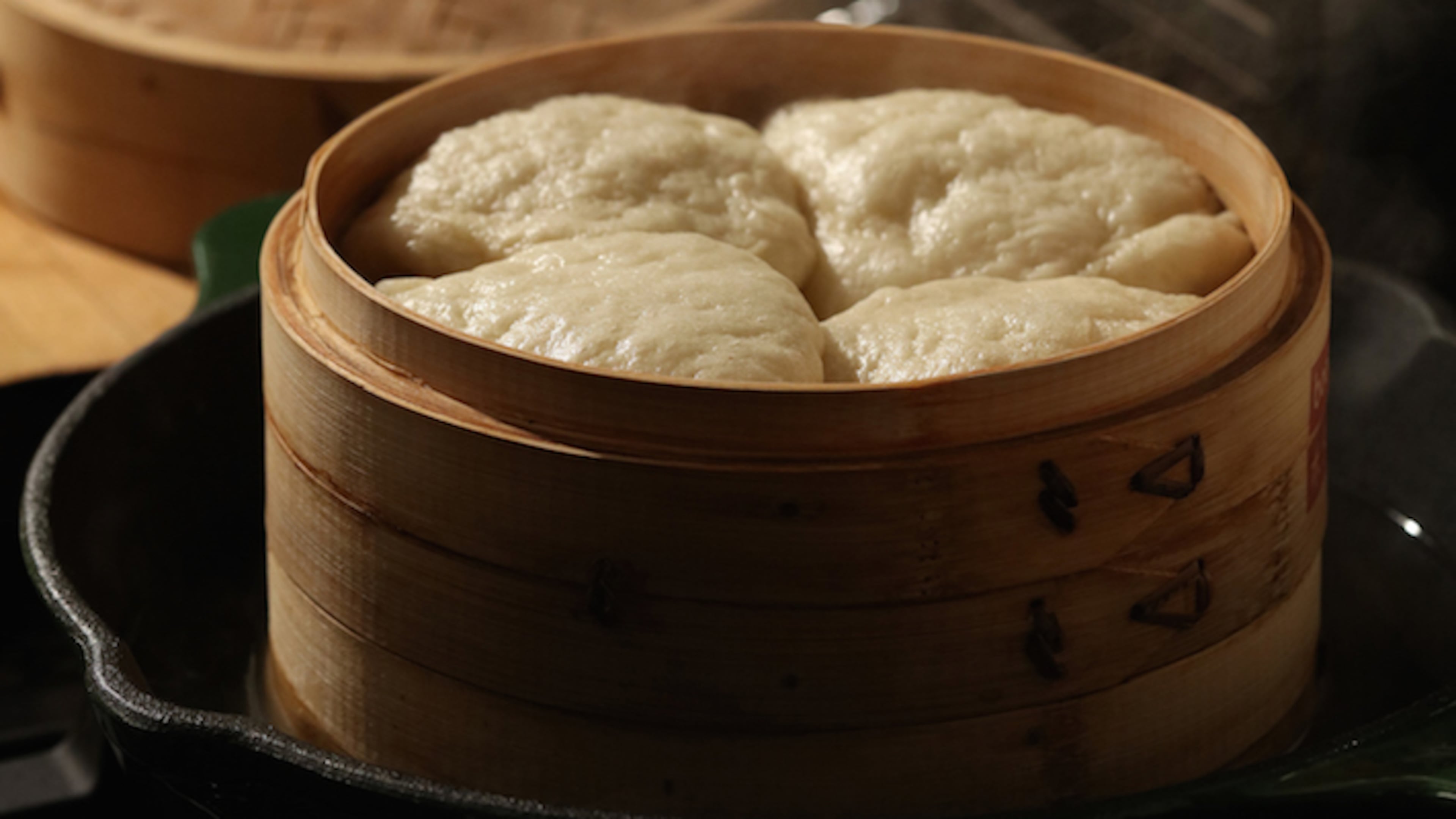 Homemade bao buns can be steamed in a traditional bamboo vessel, or in a more common metal steamer. (E. Jason Wambsgans/Chicago Tribune/TNS)