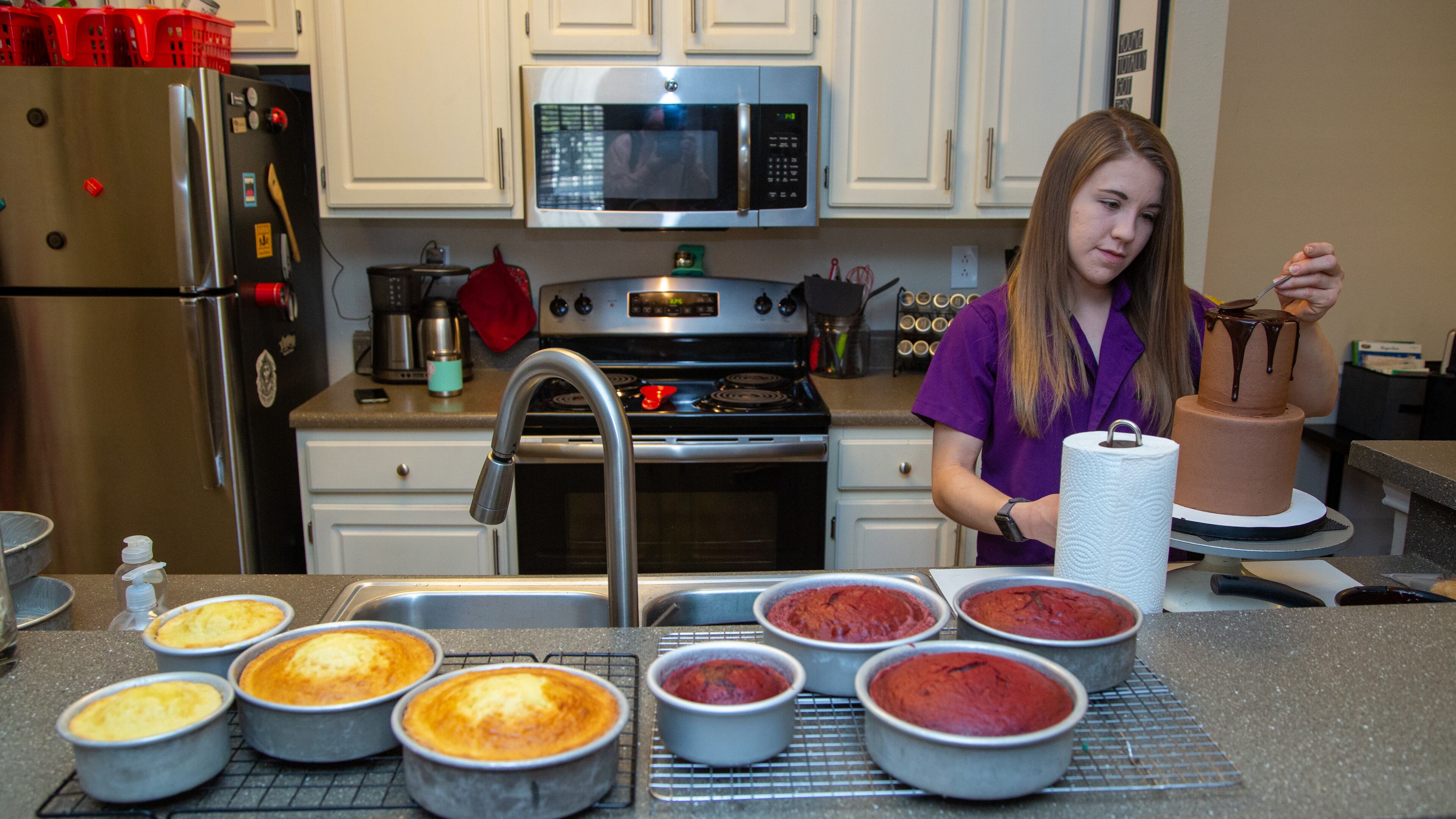 Heaven Waits of Heavenly Bakes works in the kitchen of her Buford apartment. PHIL SKINNER FOR THE ATLANTA JOURNAL-CONSTITUTION.