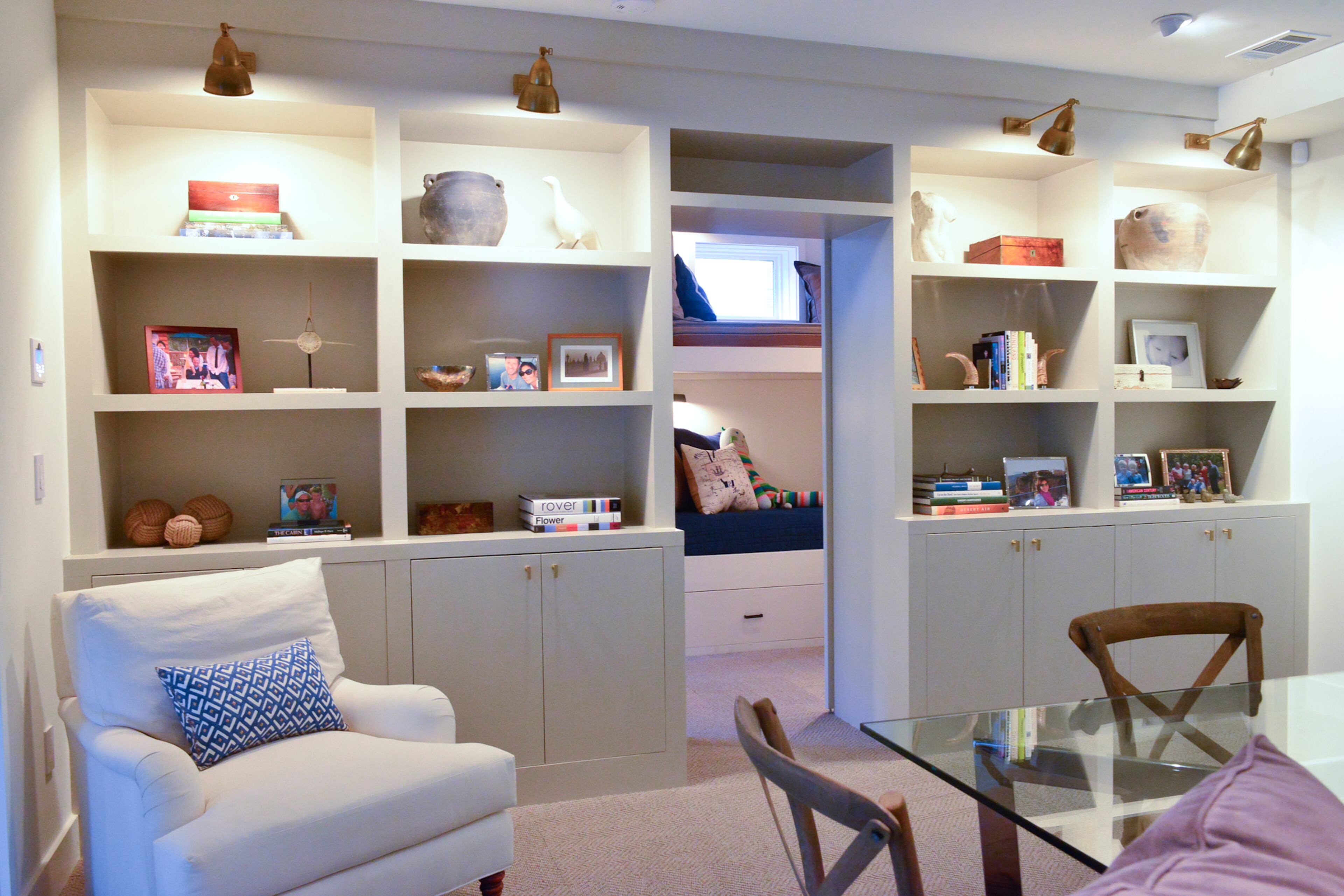 Daughtrey designed the built-in cabinetry to flank the entryway into the bunk bedroom. He took the extra step of lining the four bunk beds dead center on the door so the symmetry wasn't offset between the rooms.