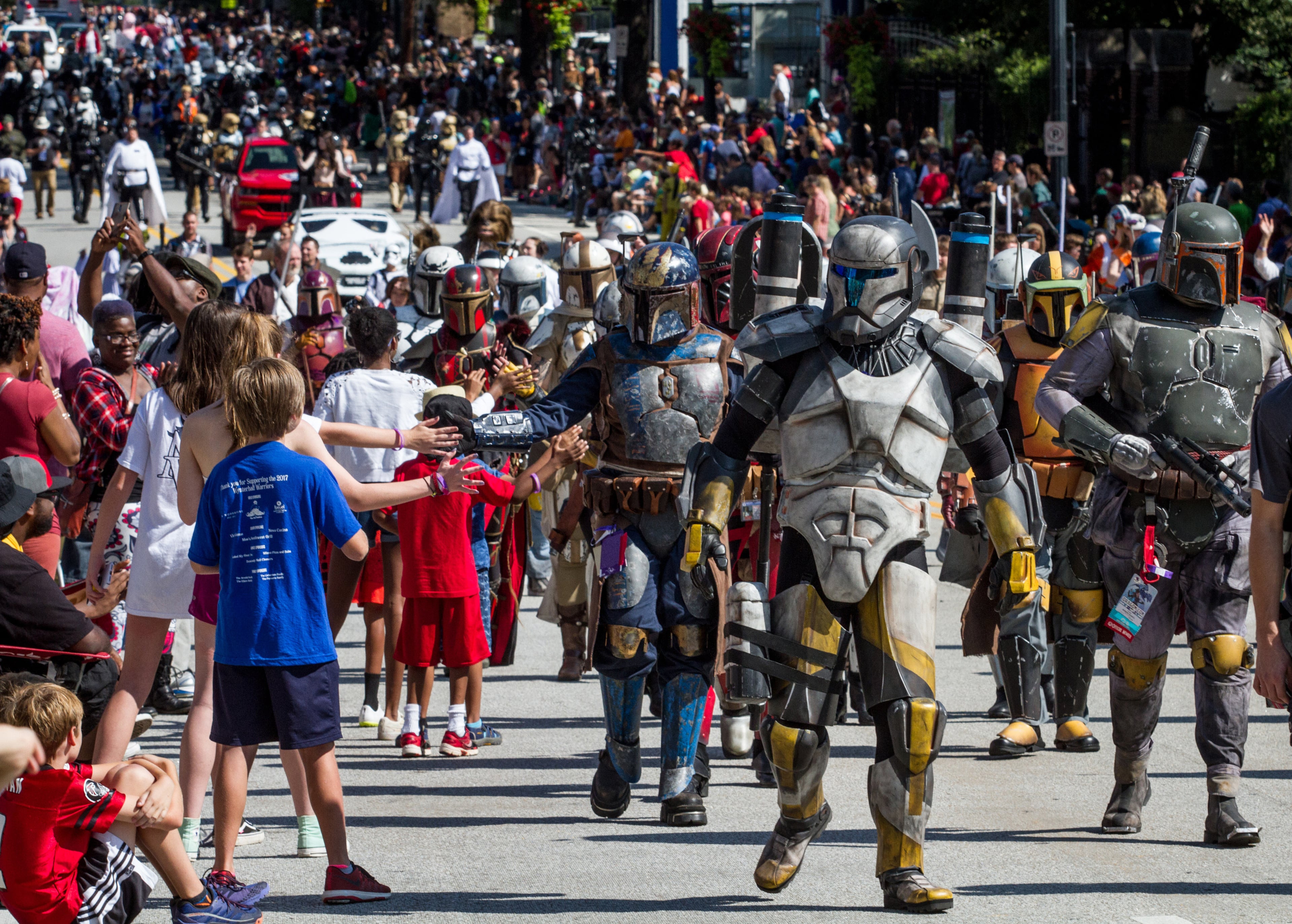 Large crowds gather along Peachtree Street Saturday to watch the Dragon Con parade in Atlanta GA September 2, 2017. STEVE SCHAEFER / SPECIAL TO THE AJC