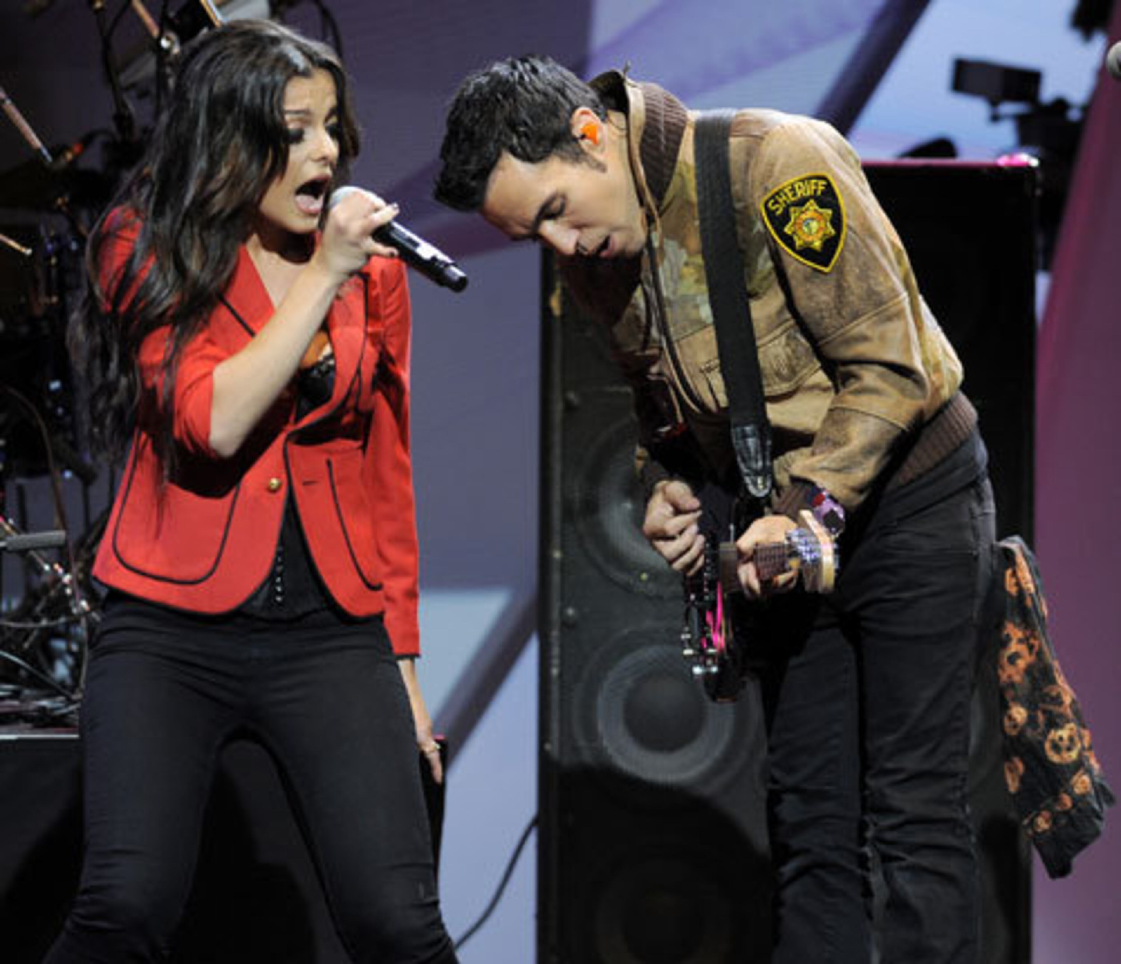 Bebe Rexha, left, and Pete Wentz of the band Black Cards perform during the awards ceremony.
