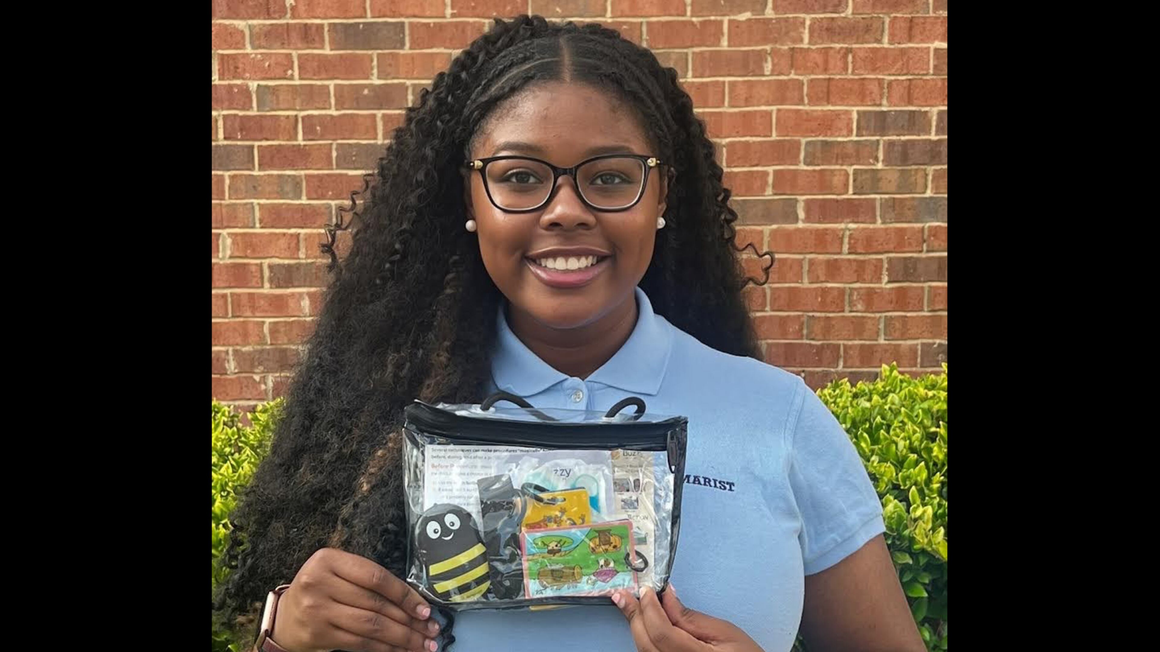 Elizabeth McCall holds a Buzzy kit. The massaging device helps ease pain for kids with cancer or blood disorders. Elizabeth is raising money to help purchase Buzzies for the Aflac Cancer and Blood Disorders Center at Children's Healthcare of Atlanta. Courtesy of Elizabeth McCall