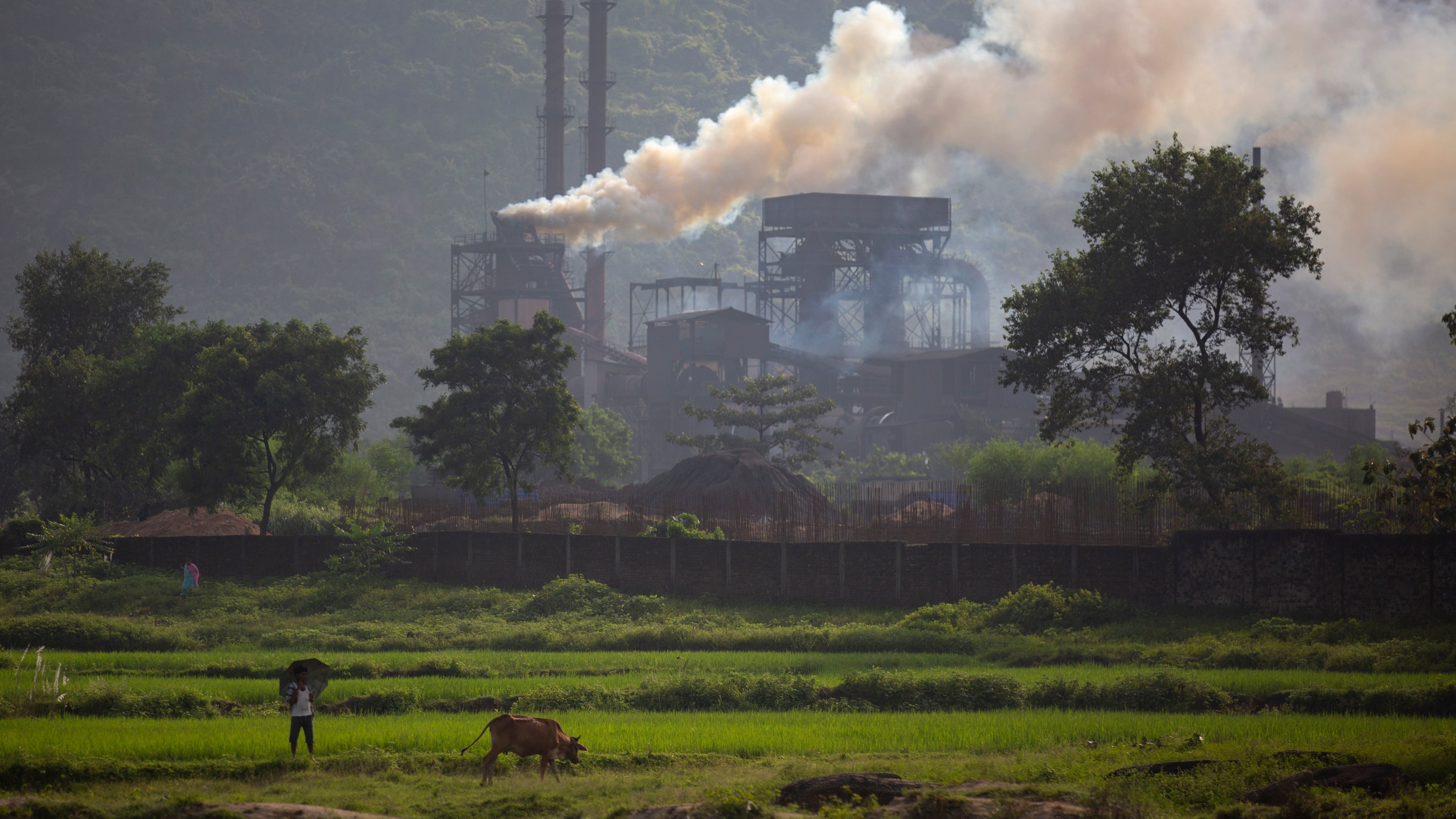 FILE- Smoke rises from a coal-powered steel plant at Hehal village near Ranchi, India, in eastern state of Jharkhand, Sept. 26, 2021. (AP Photo/Altaf Qadri, File)