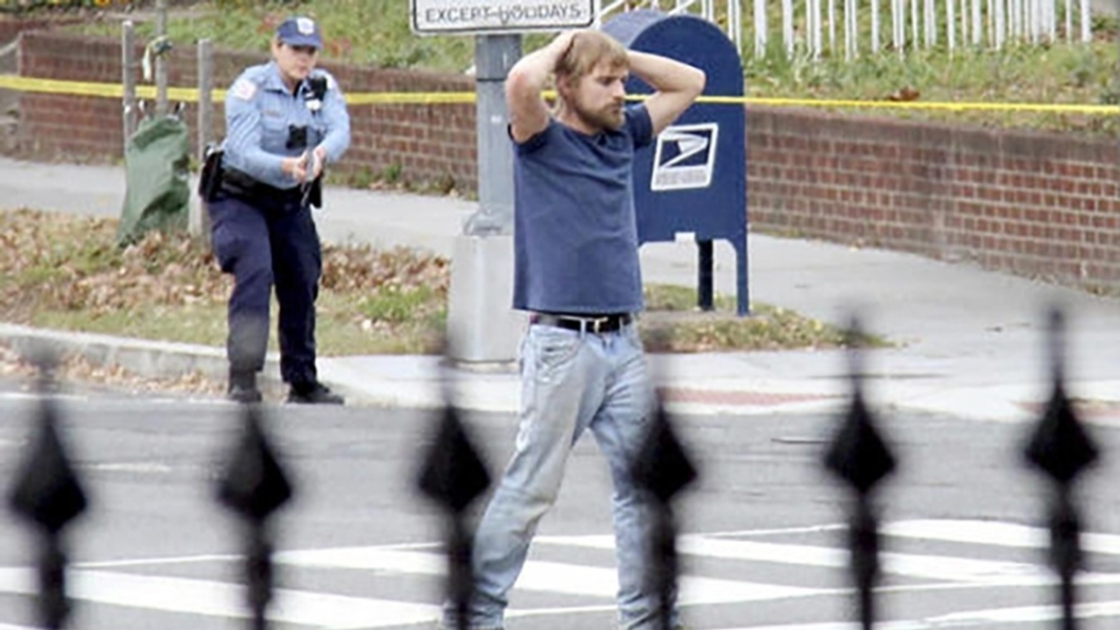 Edgar Welch is arrested outside a Washington pizzeria. AP photo.