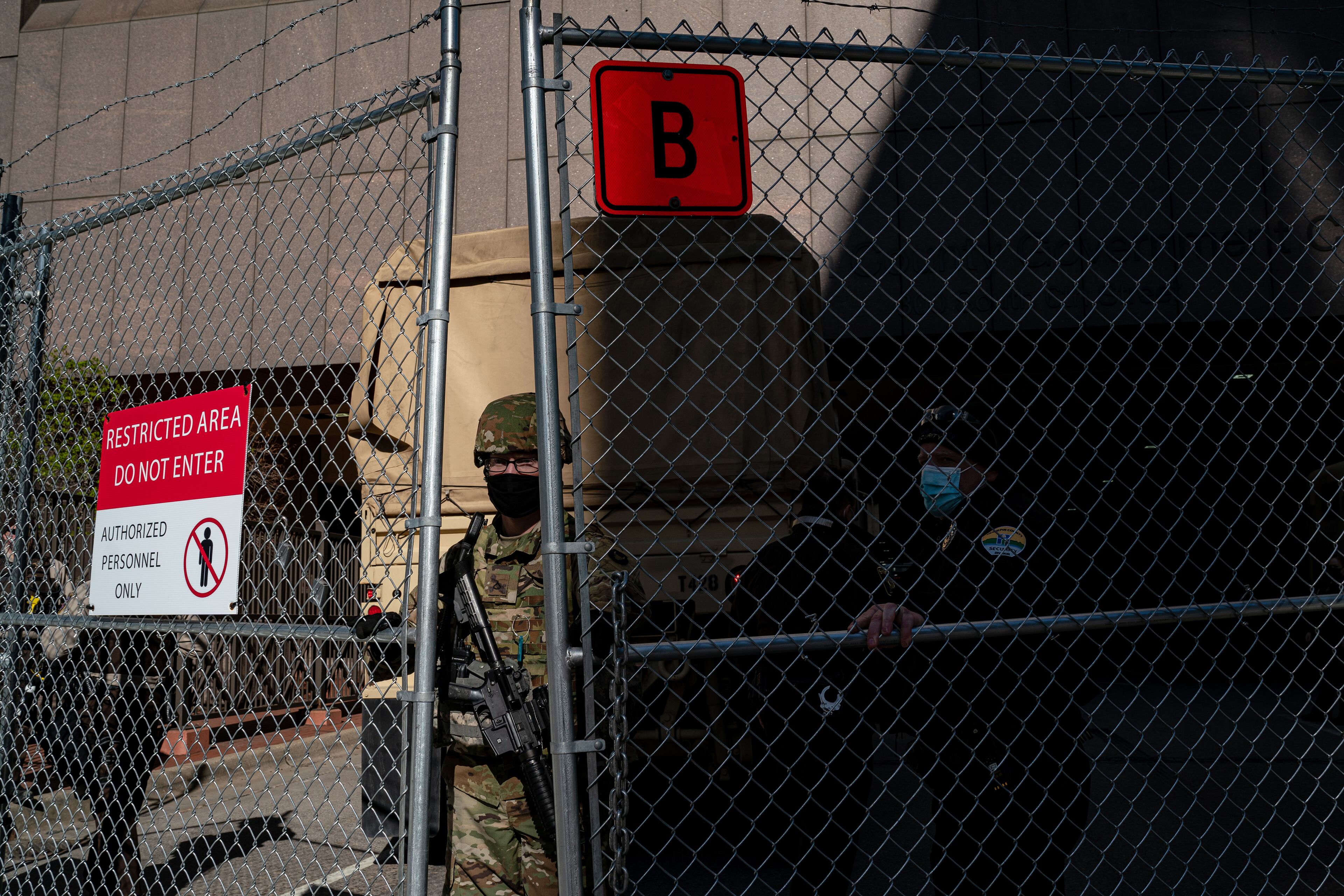 National Guard troops and law enforcement officers secure the area outside the Hennepin Country Government Center in Minneapolis on Tuesday, April 20, 2021, where the jury is deliberating the Derek Chauvin case. Chauvin, a former police officer is charged in the death of George Floyd while in police custody last year. (Amr Alfiky/The New York Times)