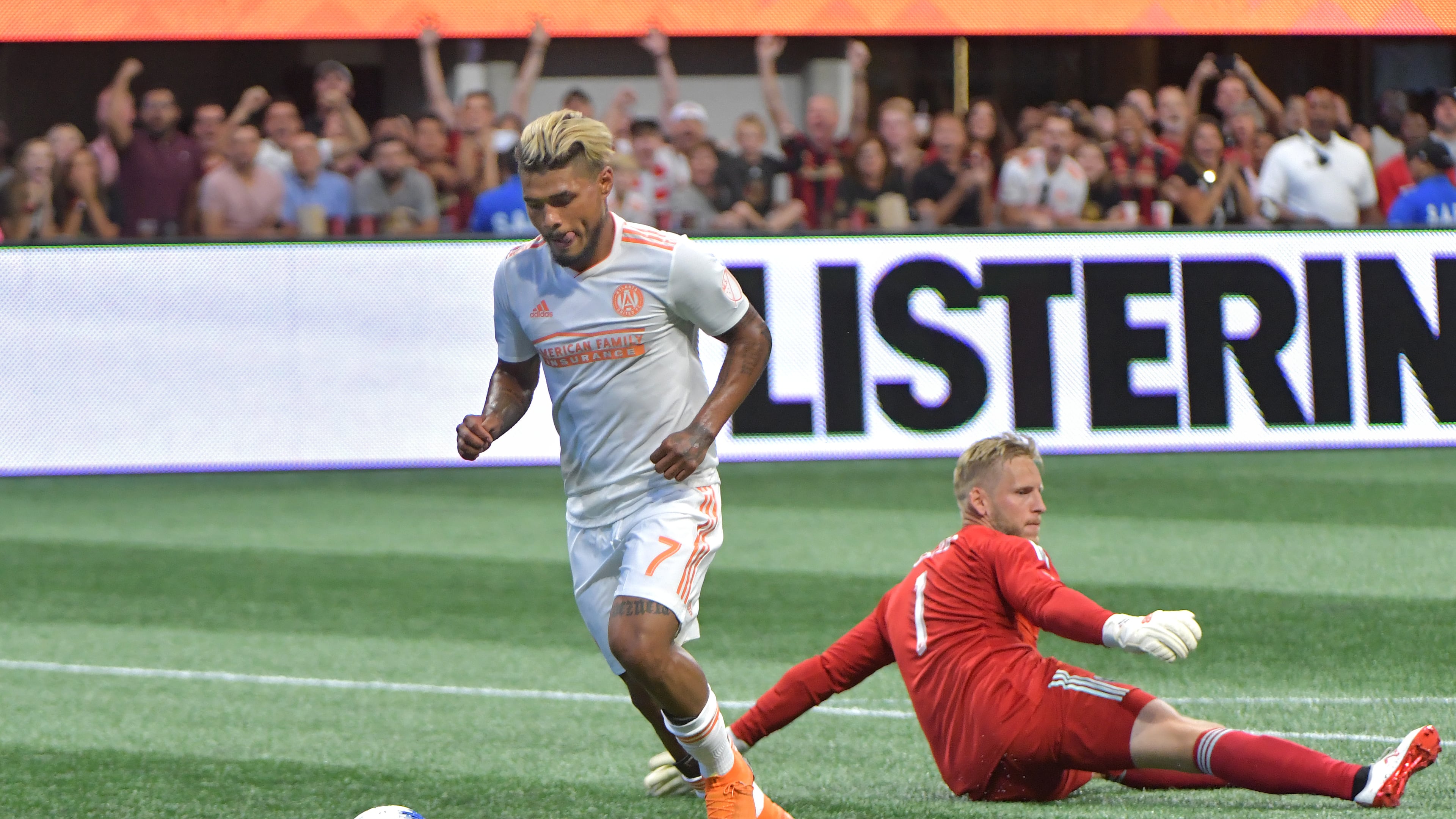 July 21, 2018 - Atlanta United forward Josef Martinez (7) gets past D.C. United goalkeeper David Ousted (1) to shoot for his 6th career MLS hat trick during the second half in a MLS soccer game at Mercedes-Benz Stadium on Saturday, July 21, 2018. Three more goals from Josef Martinez set a new MLS record lifted Atlanta United to a 3-1 victory over D.C. United on Saturday at Mercedes-Benz Stadium. HYOSUB SHIN / HSHIN@AJC.COM