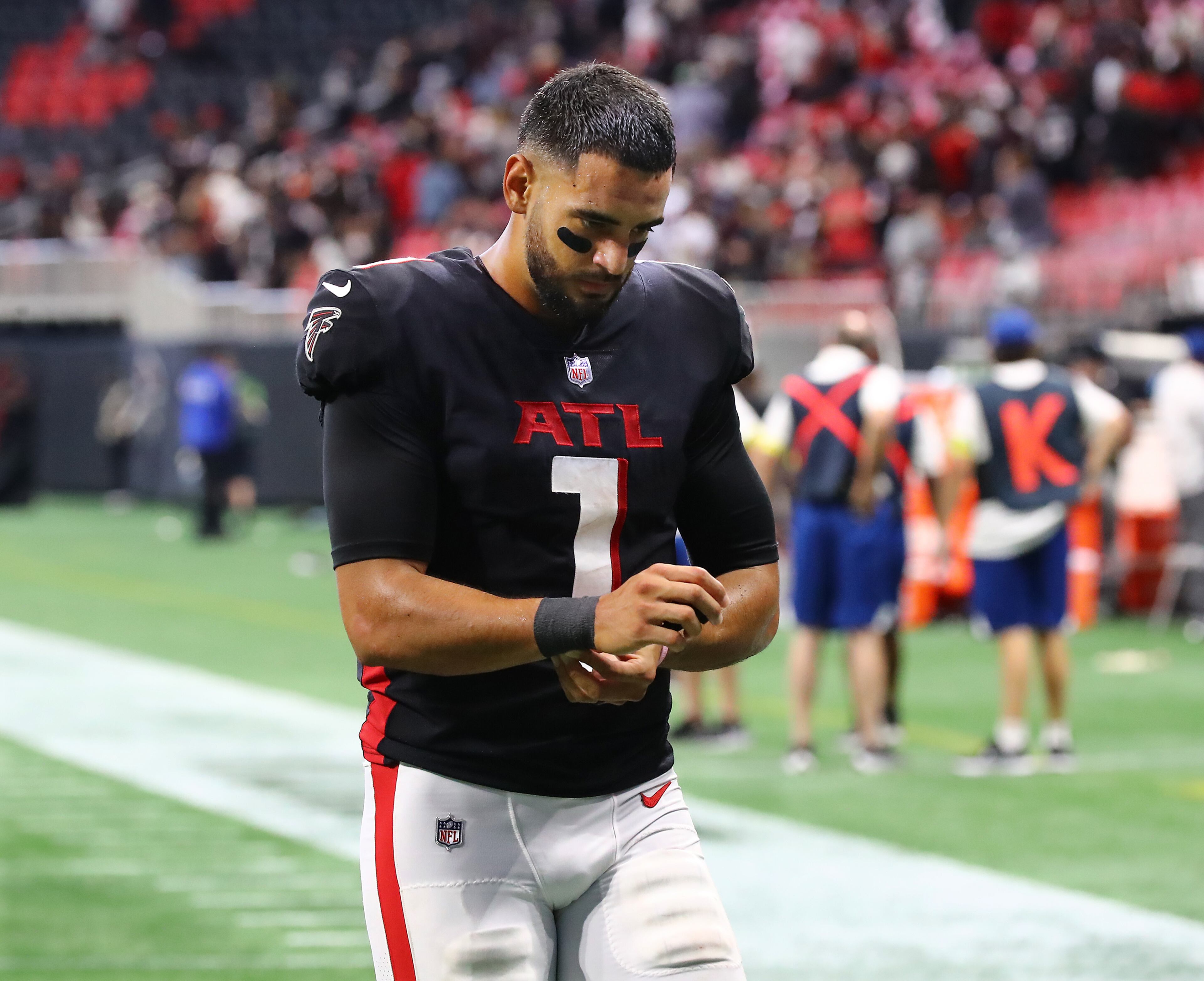 Falcons quarterback Marcus Mariota walks off the field after a heartbreaking 27-26 loss to the Saints on Sunday in Atlanta. (Curtis Compton / Curtis Compton@ajc.com)
