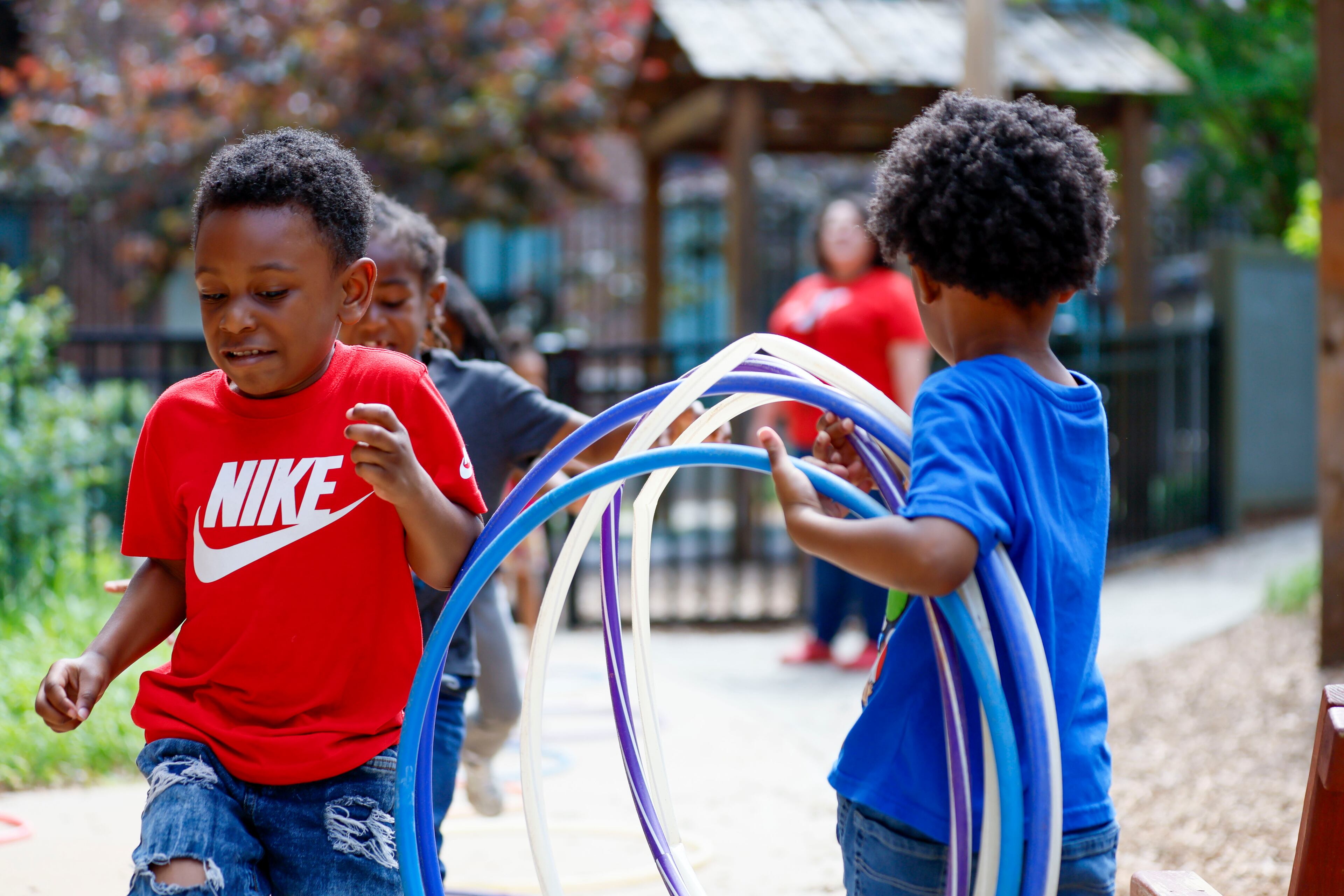 Children in the Head Start program play outside the Arthur M. Blank Early Learning Center, where providers, parents and advocates celebrated the 60th birthday of the federal Head Start program on Monday. (Miguel Martinez/AJC)
