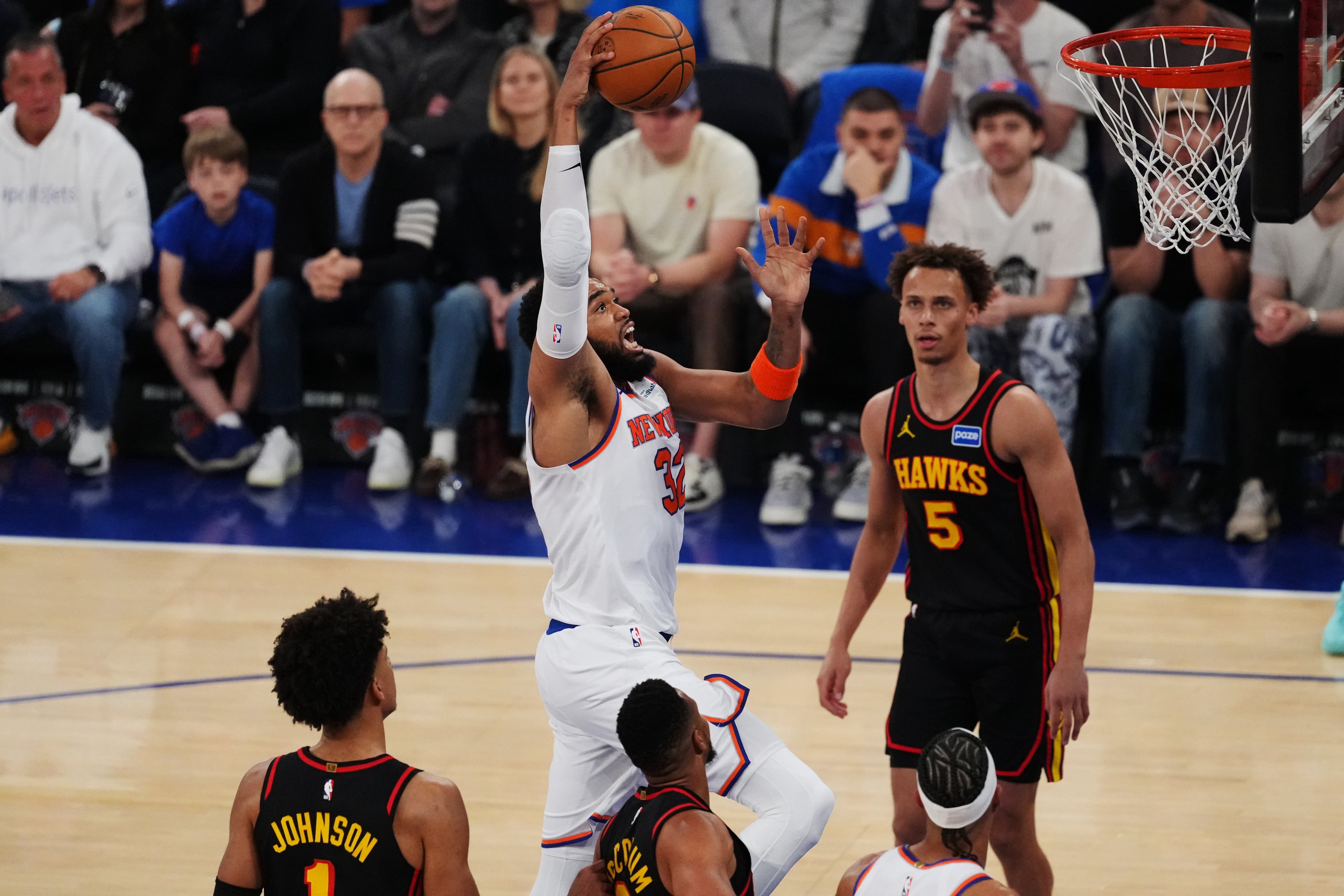 The Knicks' Karl-Anthony Towns (center) goes up for a shot against the Hawks during the first half in Game 1 of their first-round playoff series Saturday, April 18, 2026, in New York. (Frank Franklin II/AP)