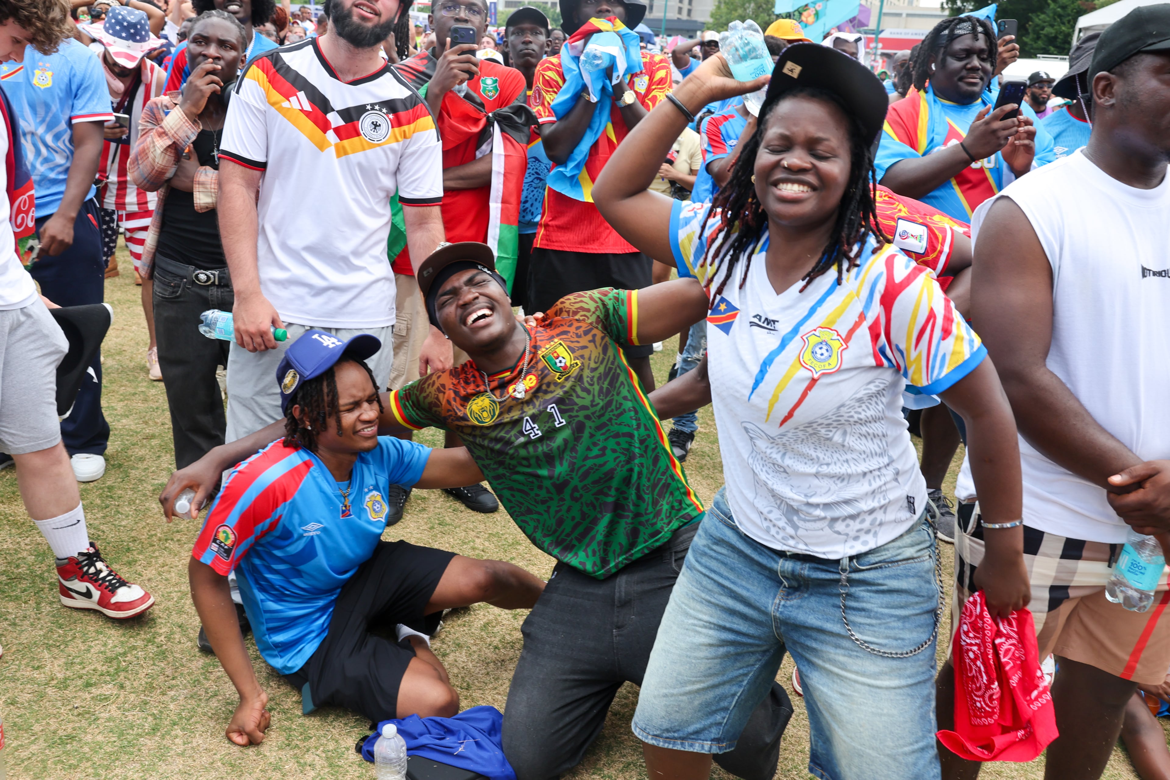 Congo fans react in the final seconds of the game at Fan Fest in Centennial Olympic Park in Atlanta in the second half of the England versus Congo FIFA World Cup game on July 1, 2026. The game was played in Atlanta Stadium (Mercedes Benz Stadium) for the knockout round of 32. England won 2-1. (Arvin Temkar/AJC)