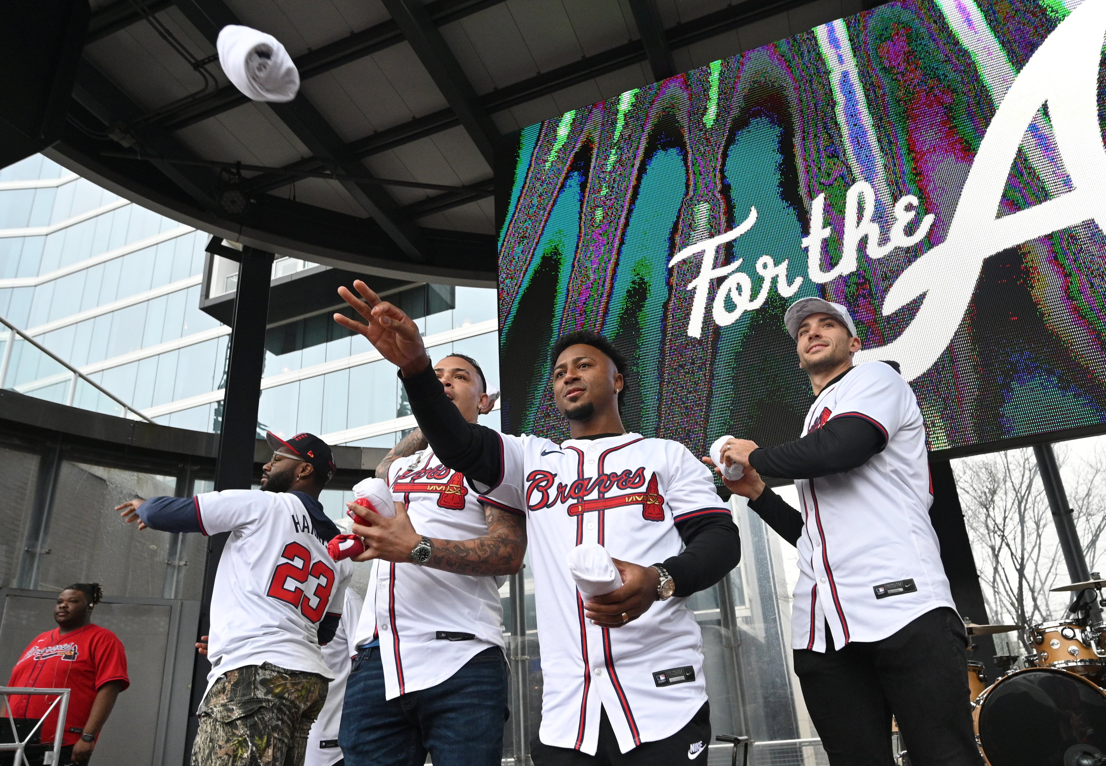 Atlanta Braves players throw free t-shirts to fans at Georgia Power Pavilion Stage during Braves Fest Opening Rally at The Battery Atlanta, Saturday, January 27, 2024, in Atlanta. (Hyosub Shin / Hyosub.Shin@ajc.com)
