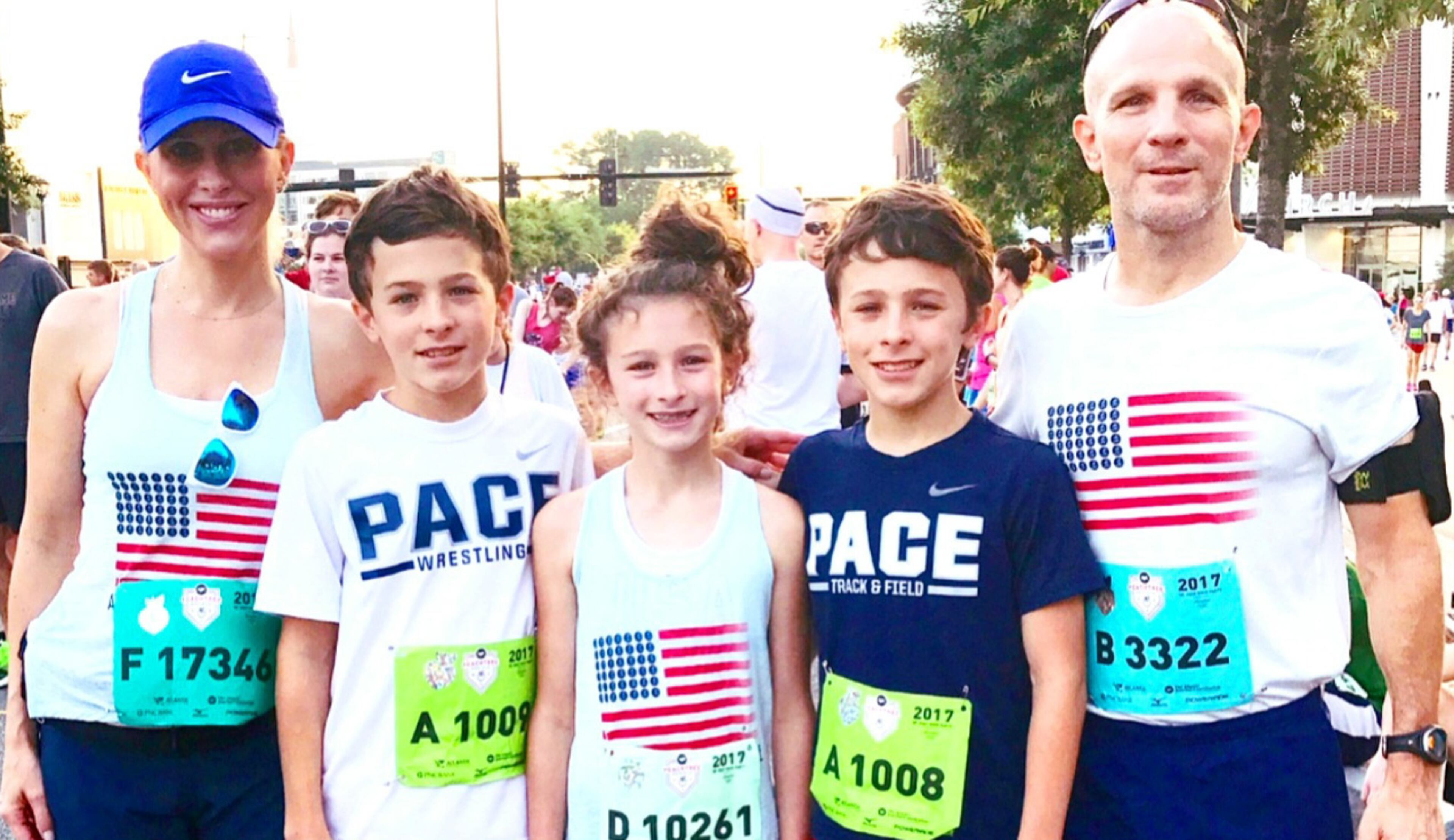 The portrait of a family at the finish line: (From left) Emily Giffin, children George, Harriet, Edward and husband Buddy Blaha. (Photo courtesy Emily Giffin)