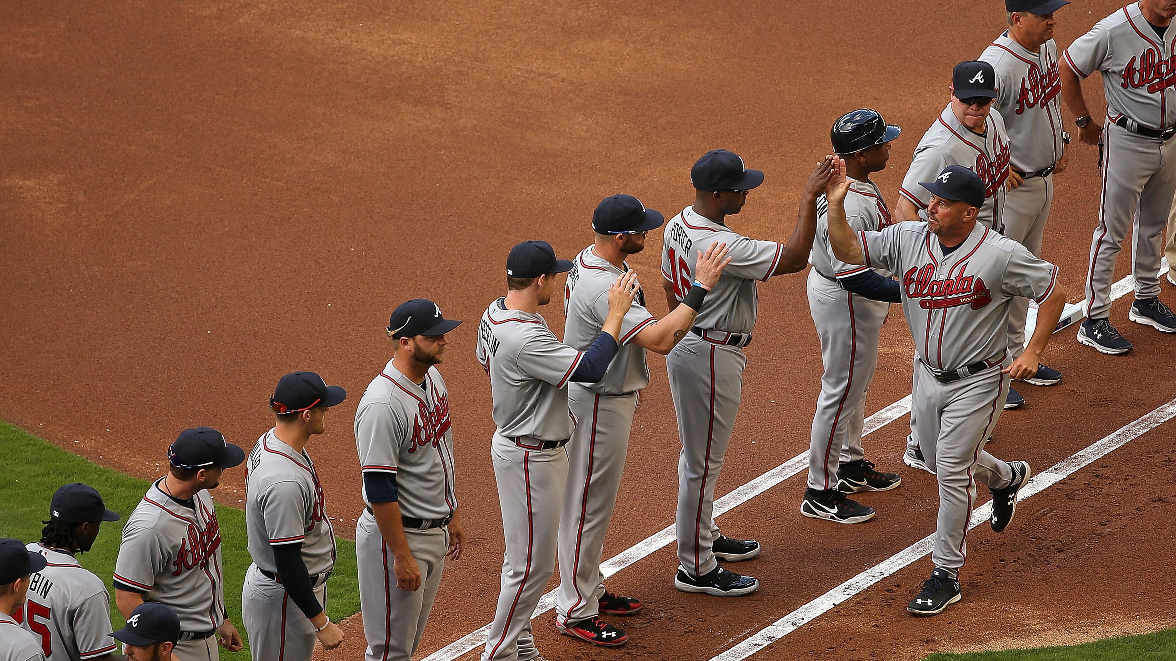 Manager Fredi Gonzalez #33 of the Atlanta Braves greets his team during Opening Day against the Atlanta Braves at Marlins Park on April 6, 2015 in Miami, Florida. The Braves would go on to win 2-1. (Photo by Mike Ehrmann/Getty Images)