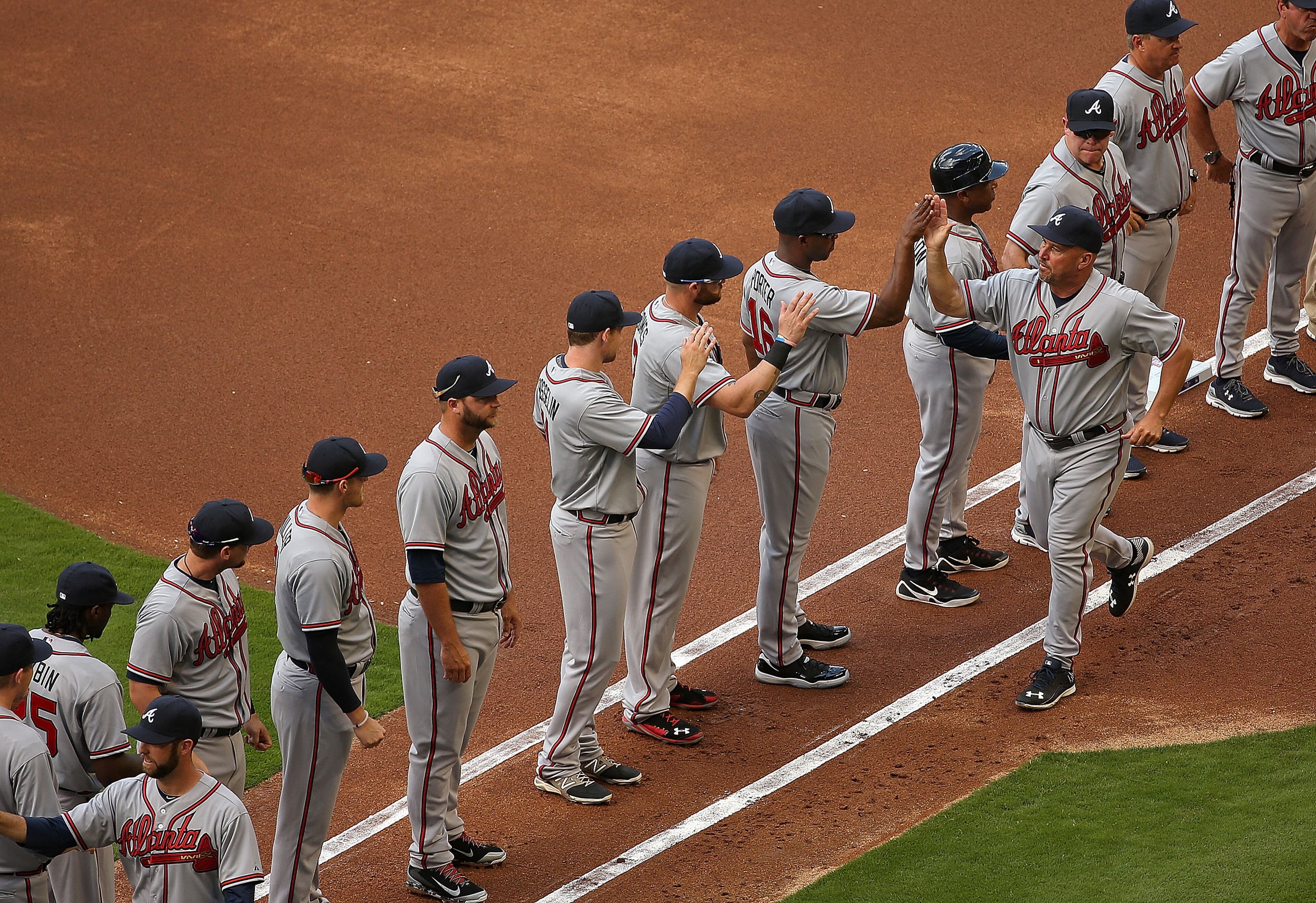 Manager Fredi Gonzalez #33 of the Atlanta Braves greets his team during Opening Day against the Atlanta Braves at Marlins Park on April 6, 2015 in Miami, Florida. The Braves would go on to win 2-1. (Photo by Mike Ehrmann/Getty Images)