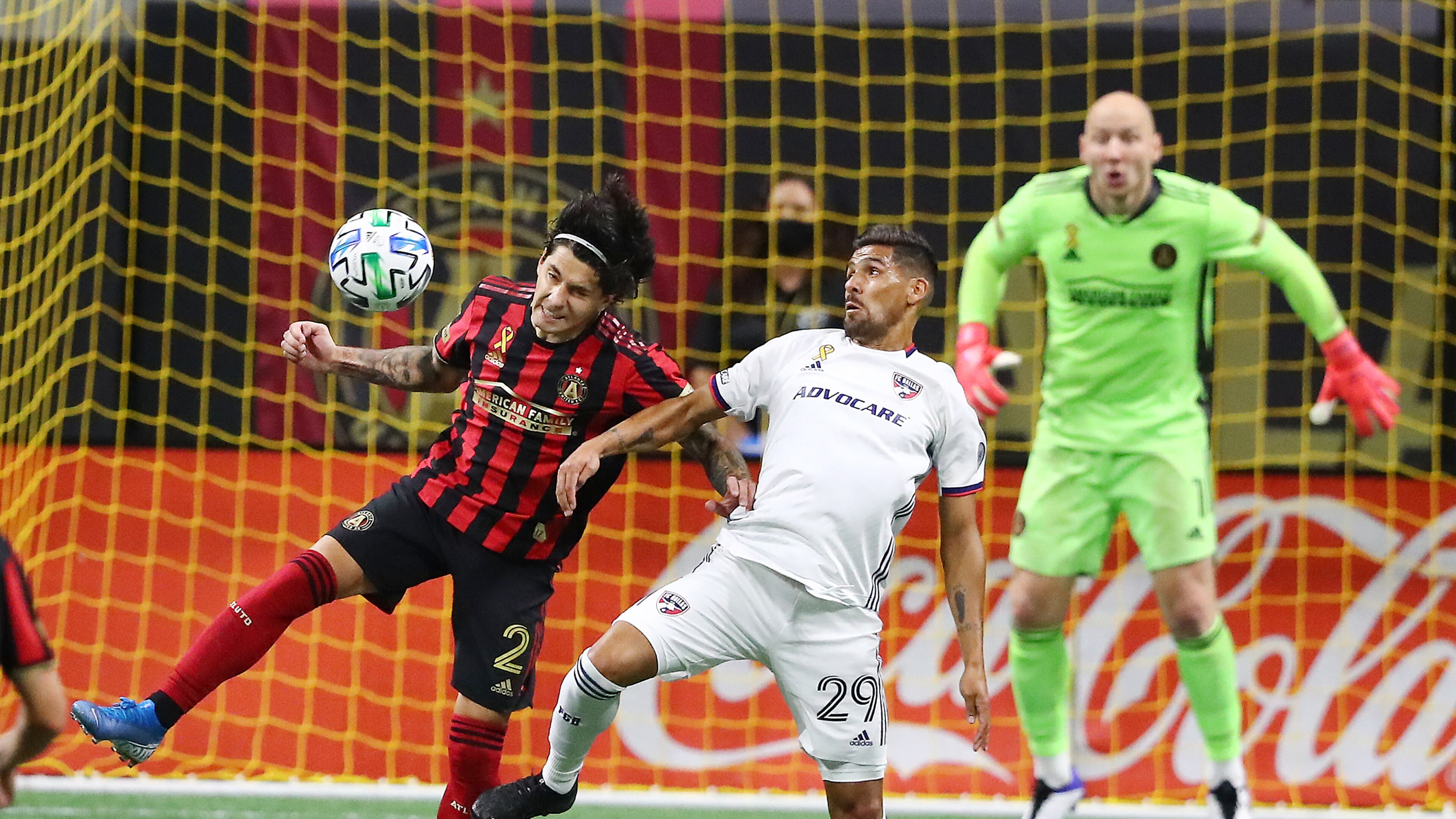 092320 Atlanta: Atlanta United defender Franco Escobar (from left) takes it away from FC Dallas forward Franco Jara in front of the goal with goalkeeper Brad Guzan looking on during the second half in a MLS soccer match on Wednesday, Sept. 23, 2020 in Atlanta. “Curtis Compton / Curtis.Compton@ajc.com”