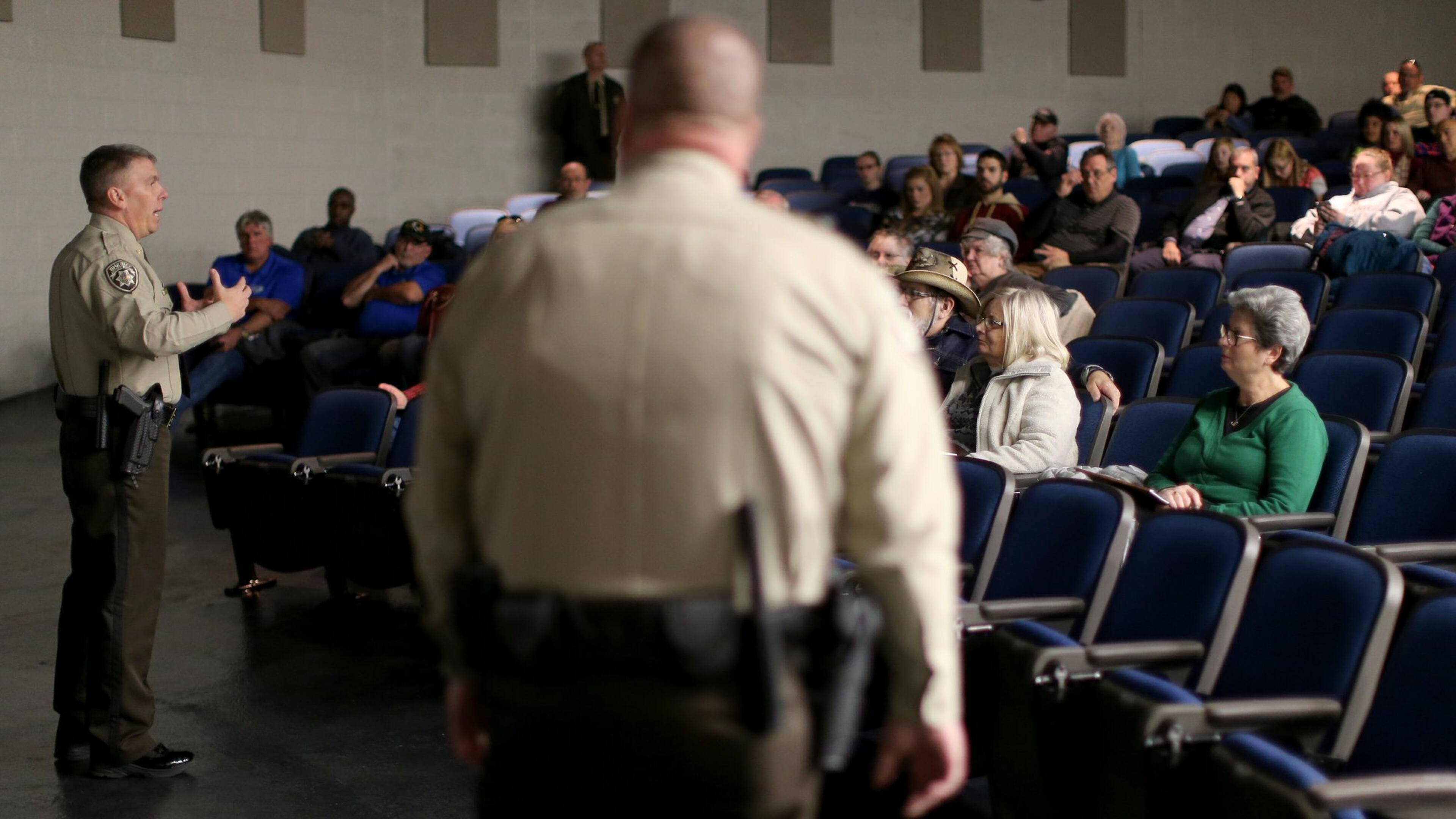 January 12, 2016 Woodstock: Cherokee County Sheriff’s Department Chief Deputy Joe Perkins, left, and Deputy Jeremy Herrin lead an active shooter seminar Tuesday evening January 12, 2016 at Etowah High School. Ben Gray / bgray@ajc.com